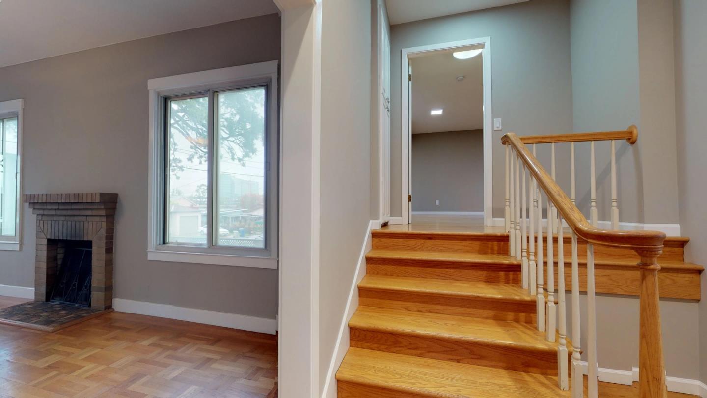 320 Cedar Street Millbrae, CA 94030 - Photo 14 of 33 a view of an entryway with wooden floor and a front door