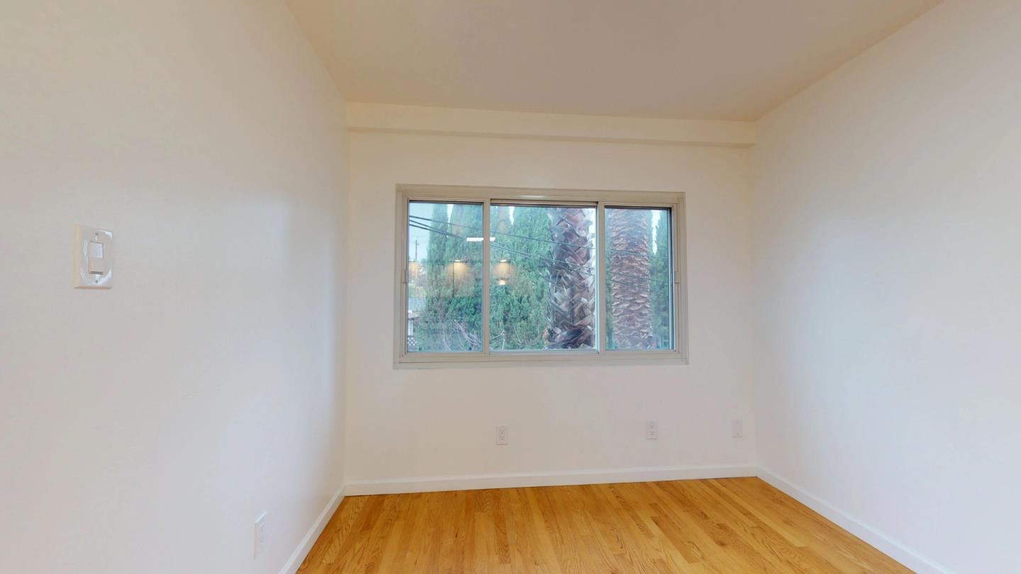 320 Cedar Street Millbrae, CA 94030 - Photo 21 of 33 a view of empty room with wooden floor and fan