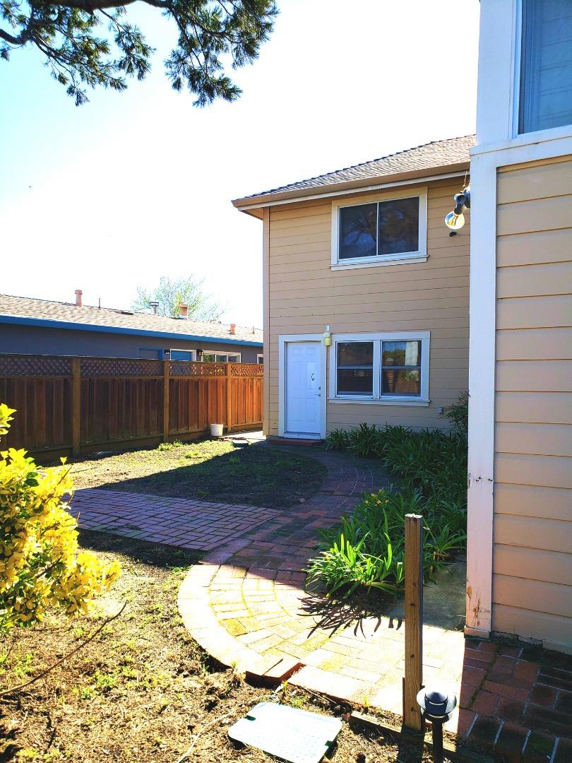 320 Cedar Street Millbrae, CA 94030 - Photo 26 of 33 a view of backyard of house with wooden fence