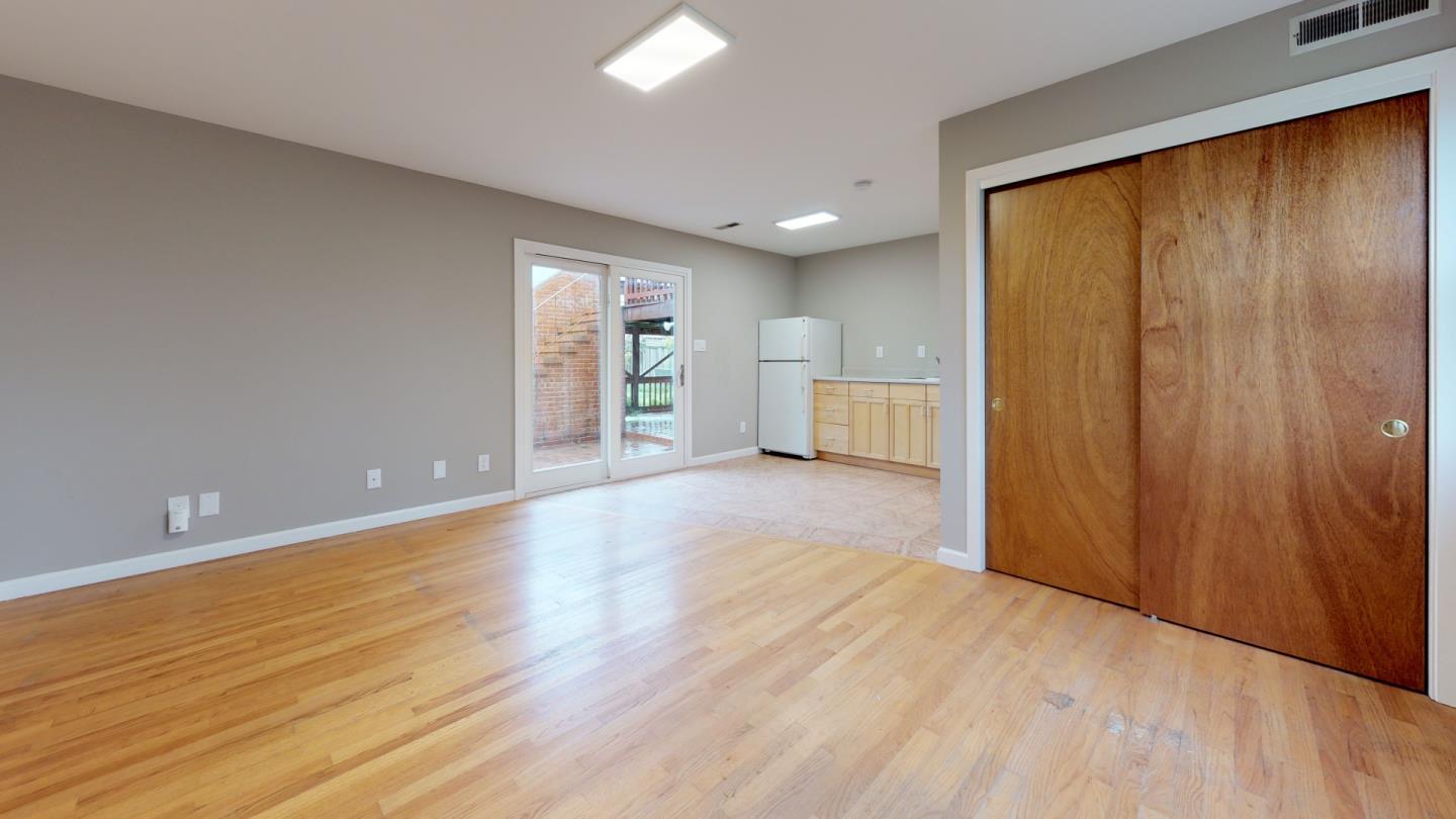 320 Cedar Street Millbrae, CA 94030 - Photo 29 of 33 a view of an empty room with wooden floor and a window
