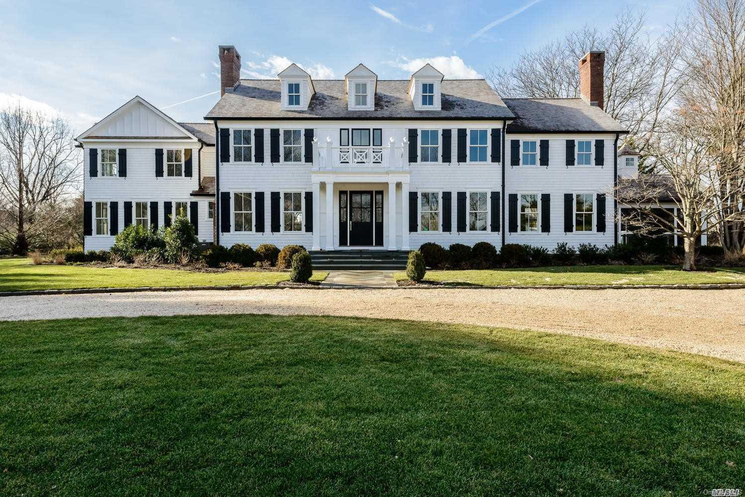 a front view of building with yard and green space