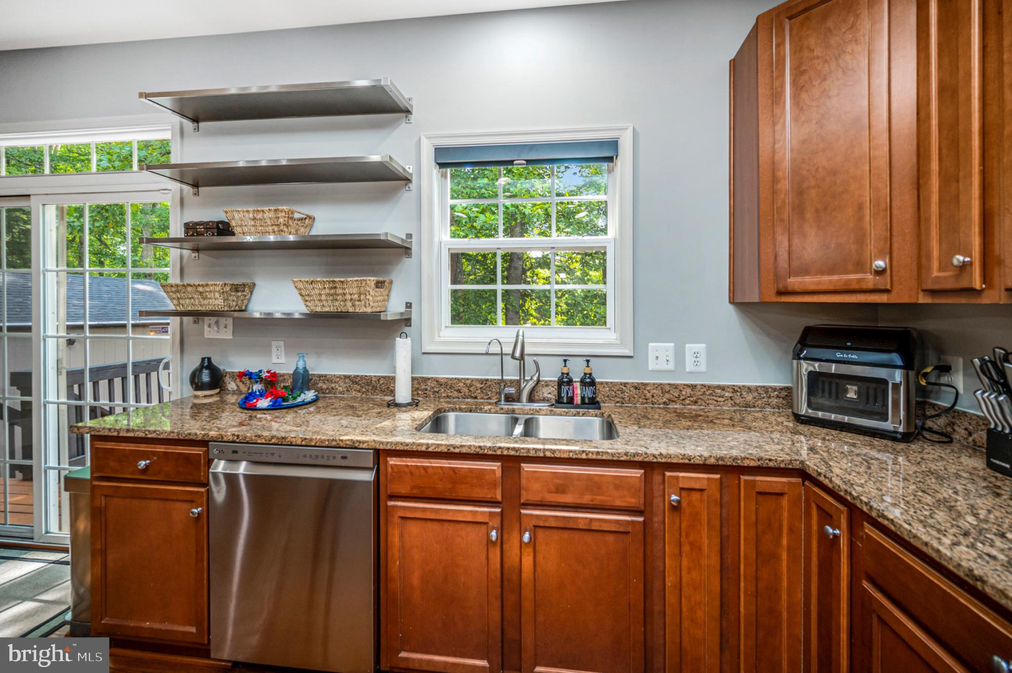 239 Toluca Road Stafford, VA 22556 - Photo 42 of 75 Modern kitchen with warm wood accents.