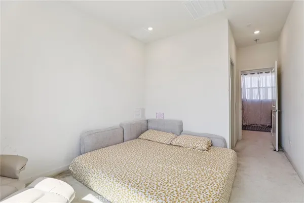 a bedroom with a bed and a cabinets