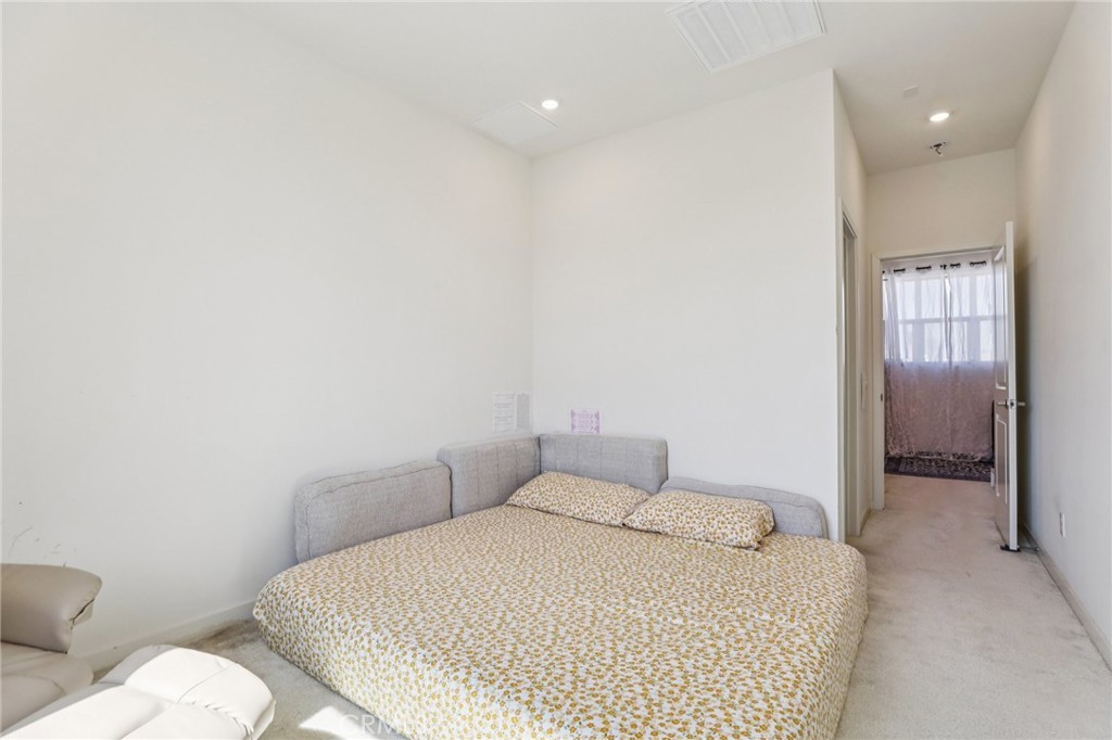 1571 Lima Way, Unit 5 Placentia, CA 92870 - Photo 12 of 21 a bedroom with a bed and mirror