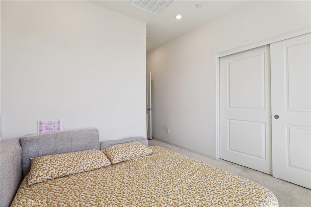 1571 Lima Way, Unit 5 Placentia, CA 92870 - Photo 13 of 21 a bedroom with a bed and a cabinets
