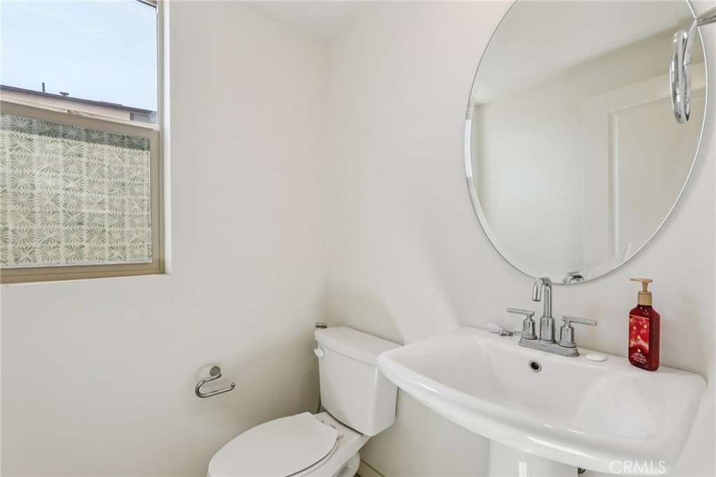 1571 Lima Way, Unit 5 Placentia, CA 92870 - Photo 16 of 21 a bathroom with a sink mirror and toilet