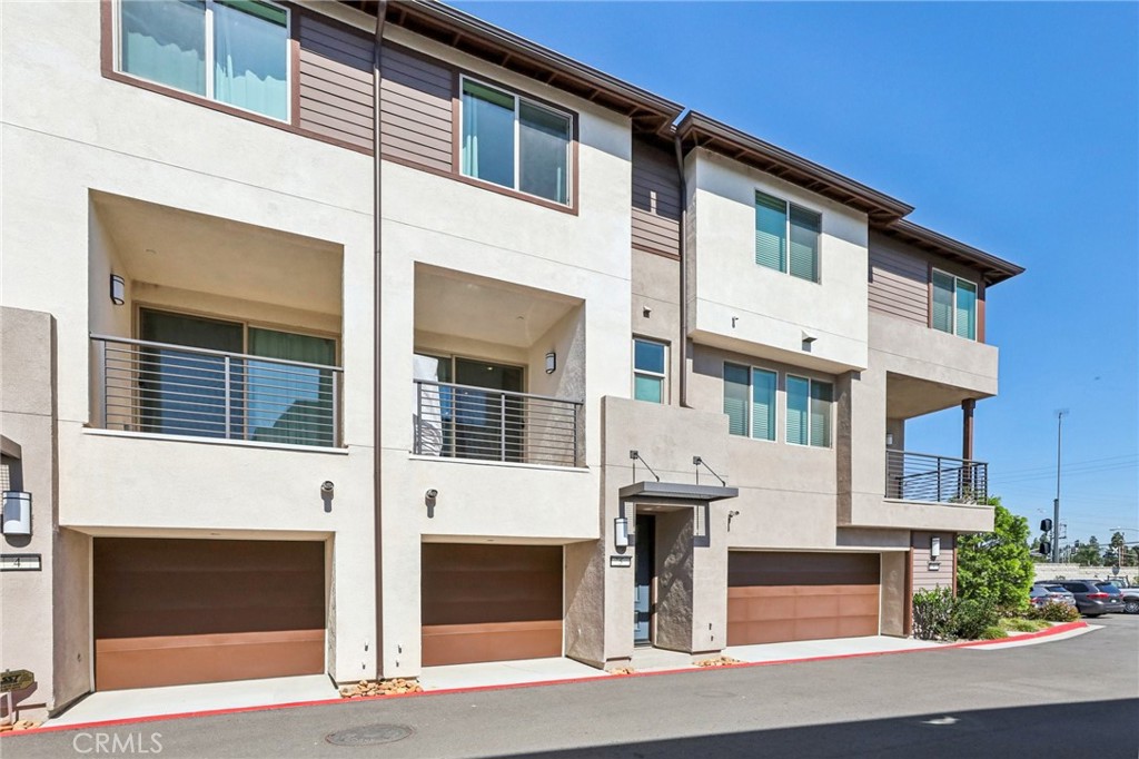 1571 Lima Way, Unit 5 Placentia, CA 92870 - Photo 2 of 21 a front view of a building with a road