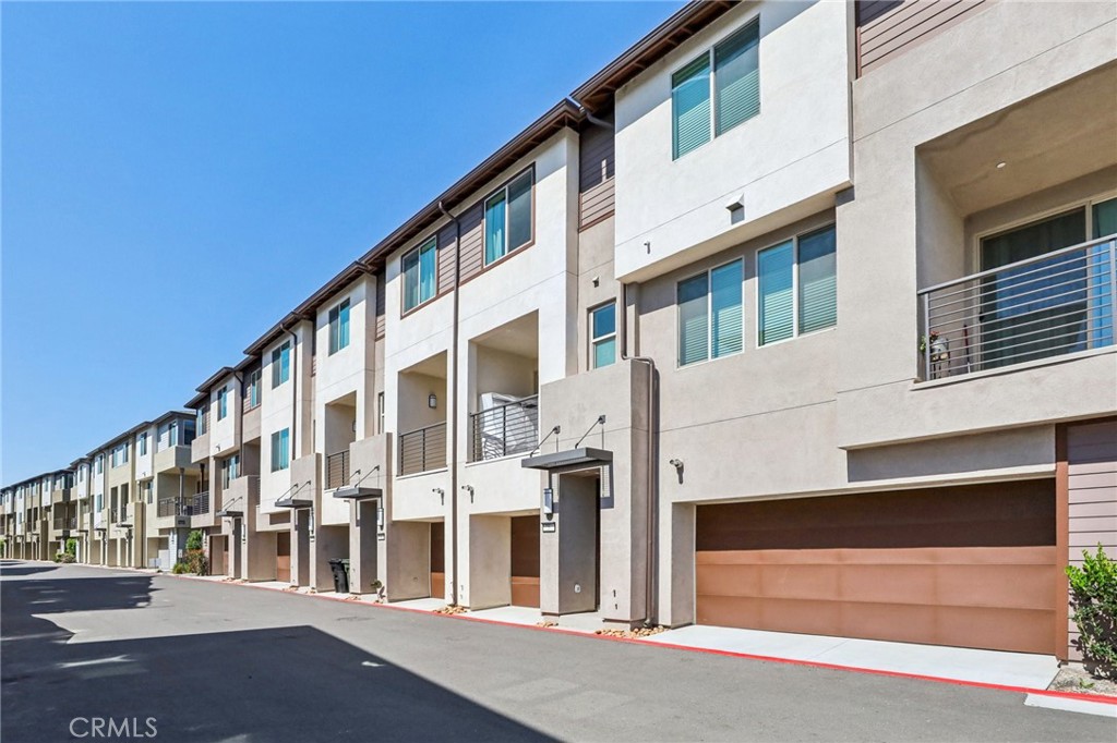 1571 Lima Way, Unit 5 Placentia, CA 92870 - Photo 3 of 21 a view of building with large windows