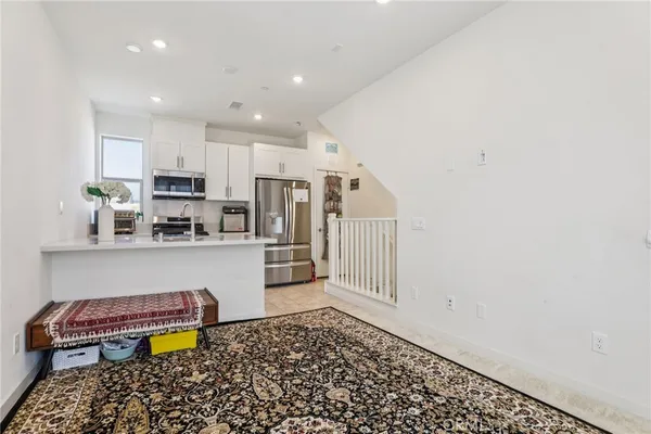 a view of a room with a bench and a window