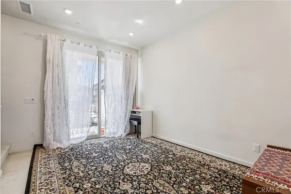 a kitchen with stainless steel appliances granite countertop a refrigerator sink and microwave