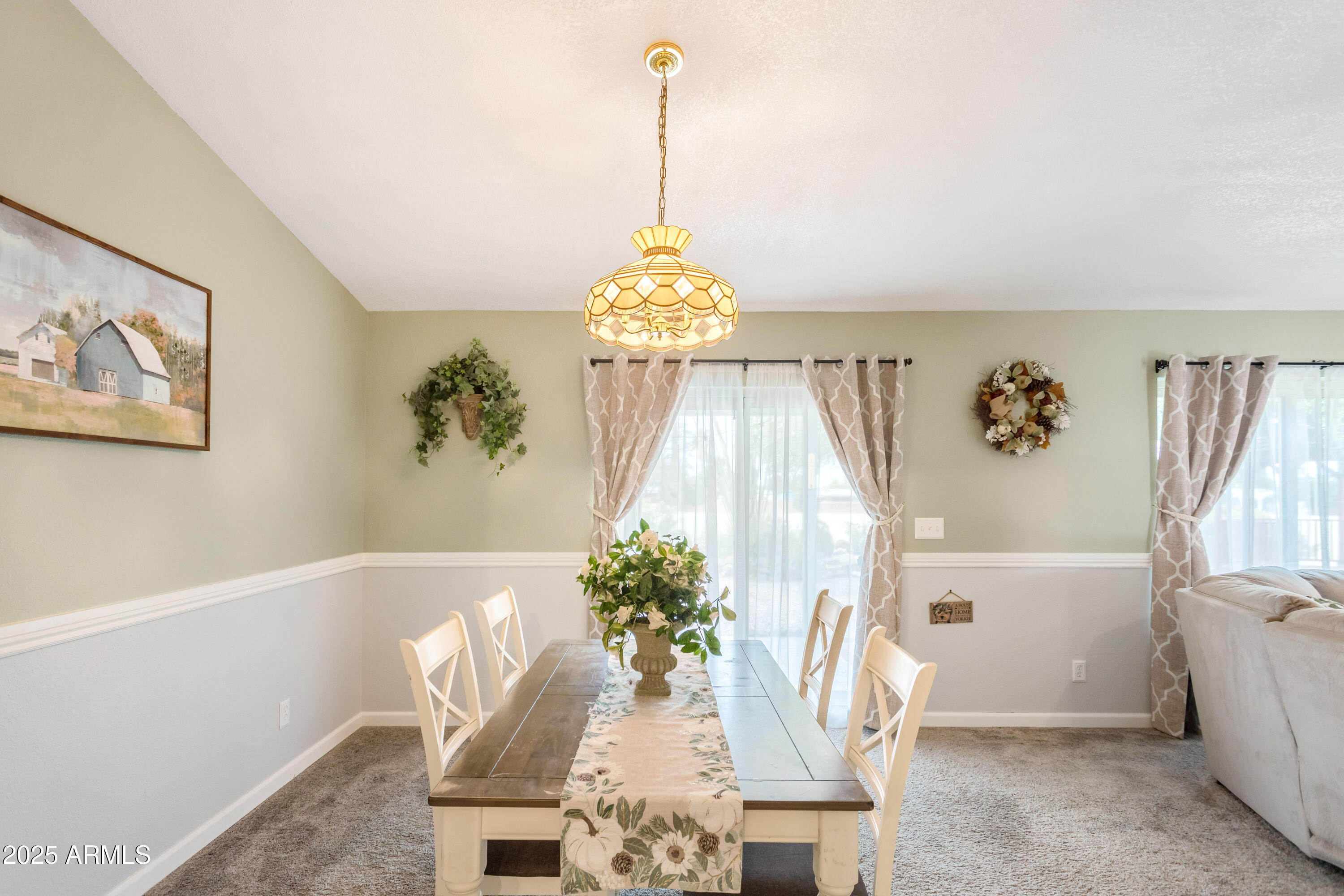 4931 Loma Loop Sierra Vista, AZ 85635 - Photo 13 of 47 a living room with furniture and a chandelier