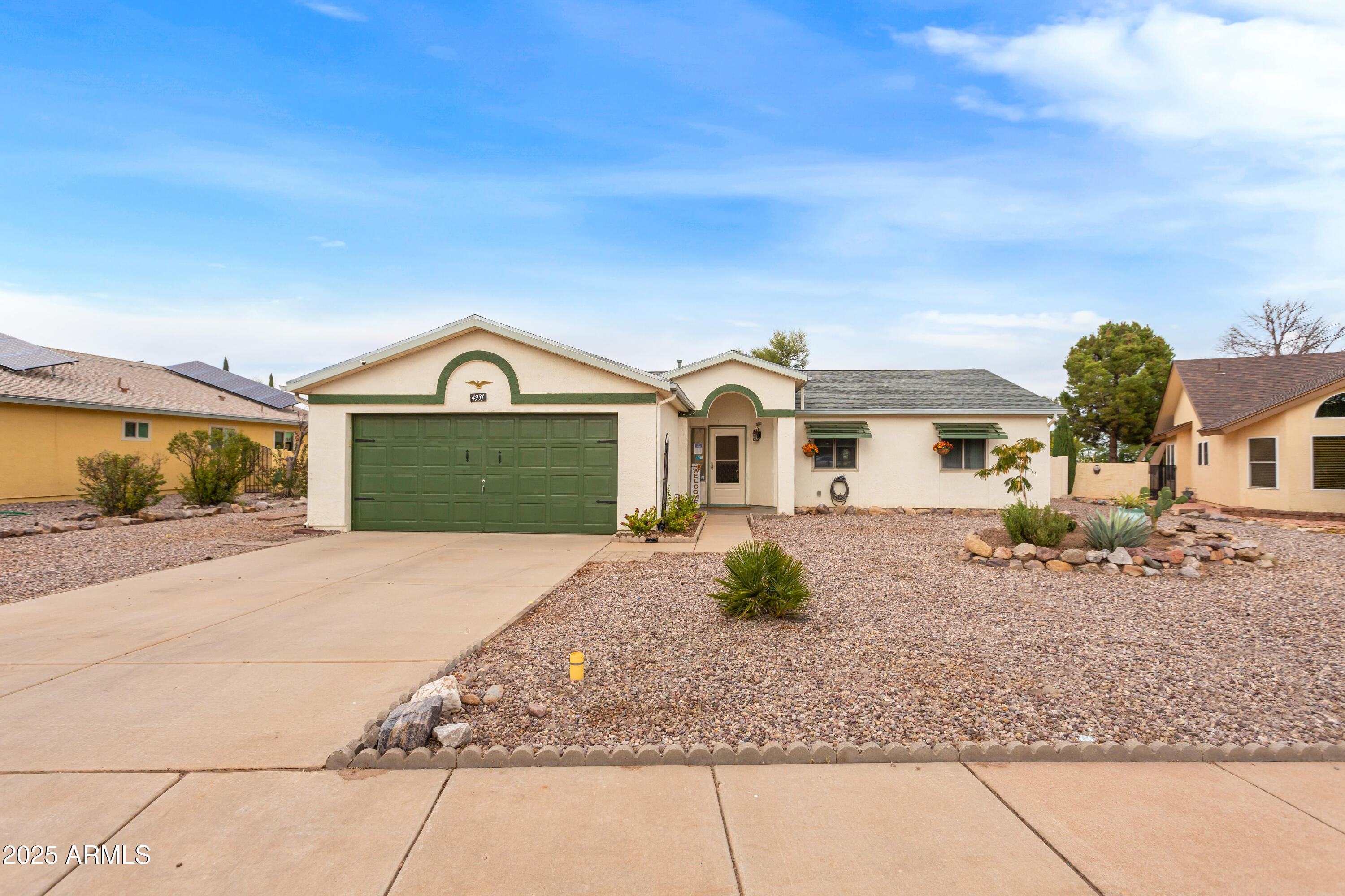 4931 Loma Loop Sierra Vista, AZ 85635 - Photo 2 of 47 a front view of a house with a yard