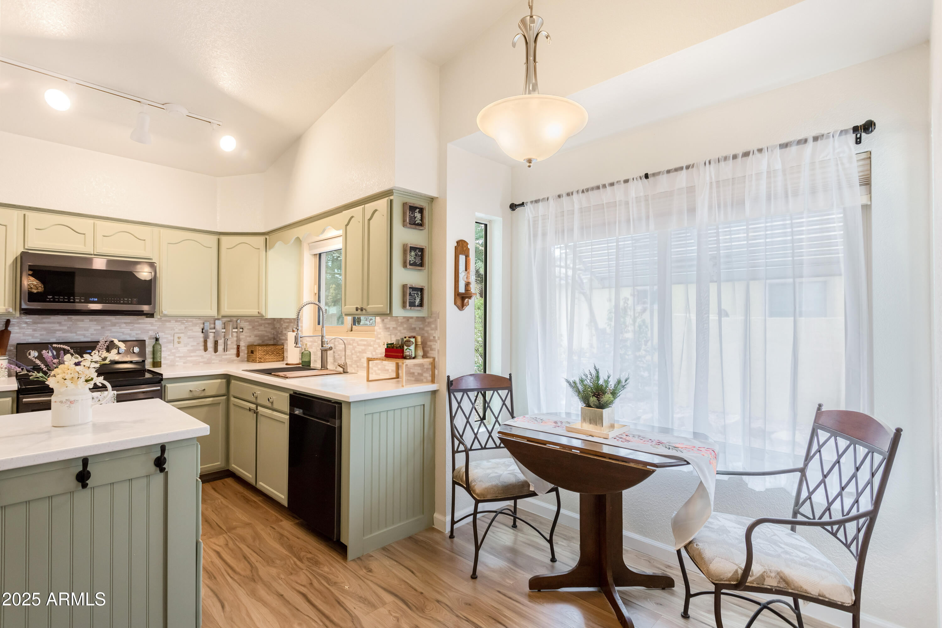 4931 Loma Loop Sierra Vista, AZ 85635 - Photo 21 of 47 a view of a dining room with furniture window and wooden floor