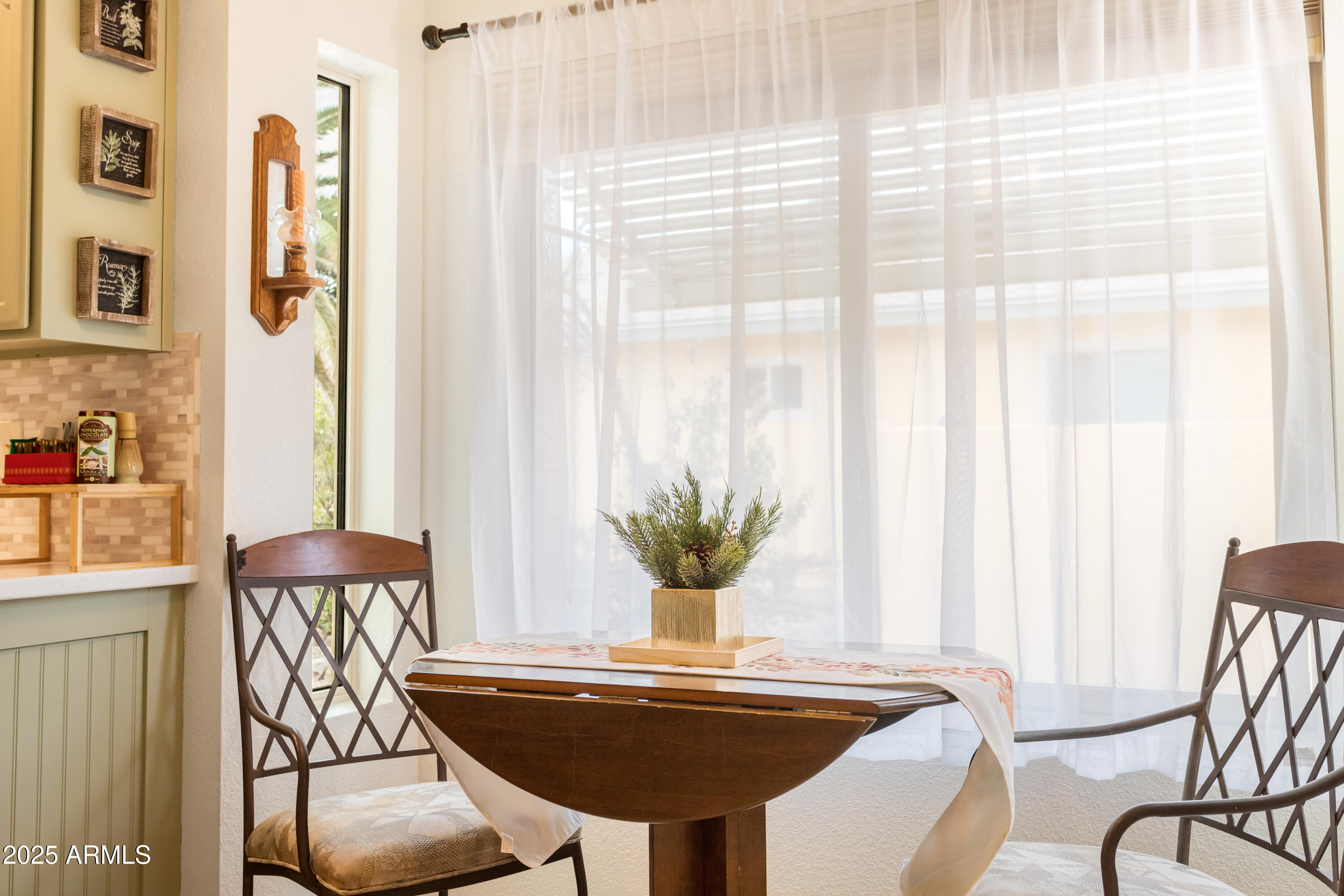 4931 Loma Loop Sierra Vista, AZ 85635 - Photo 22 of 47 a view of a dining room with furniture and a large window