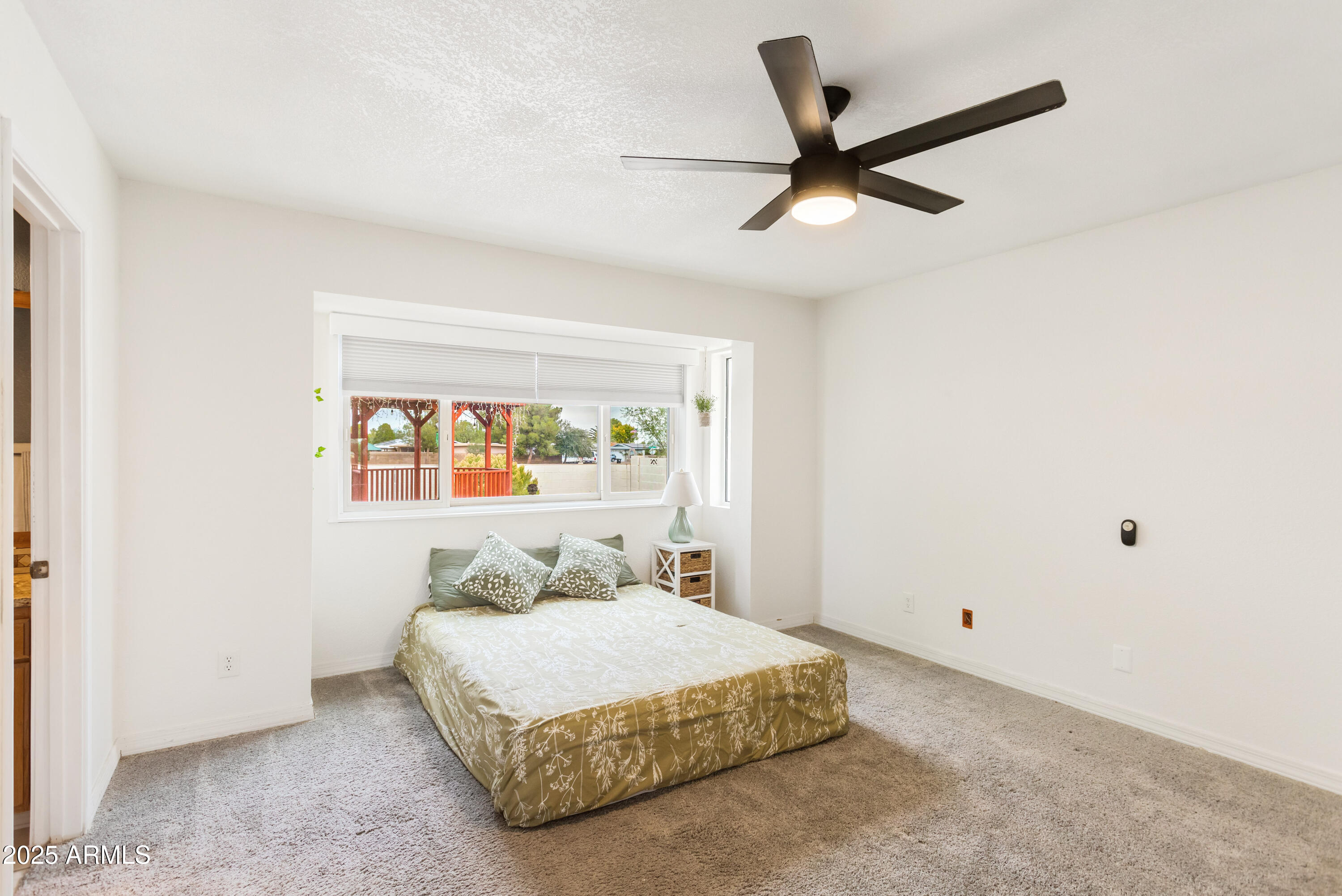 4931 Loma Loop Sierra Vista, AZ 85635 - Photo 24 of 47 a bedroom with a bed and window