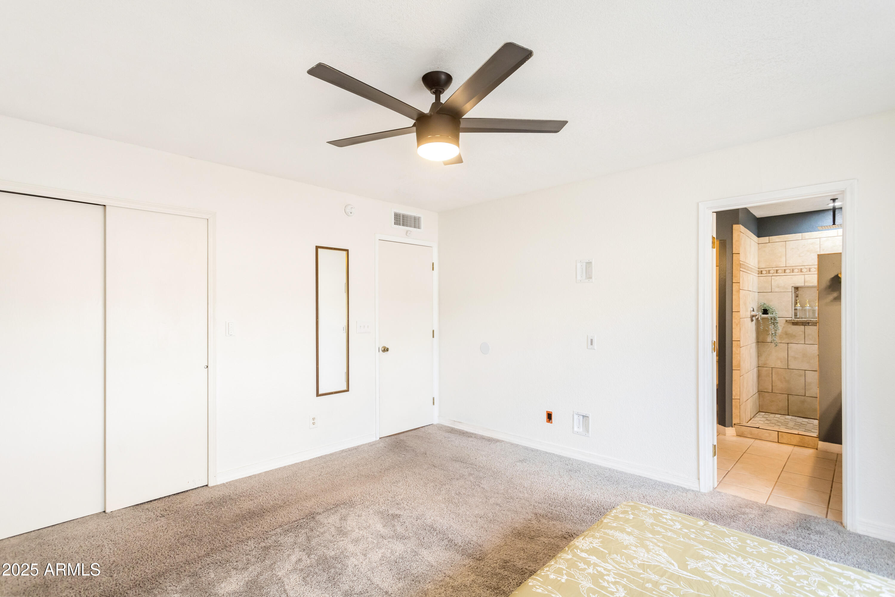 4931 Loma Loop Sierra Vista, AZ 85635 - Photo 25 of 47 a view of a livingroom with a ceiling fan and wooden floor