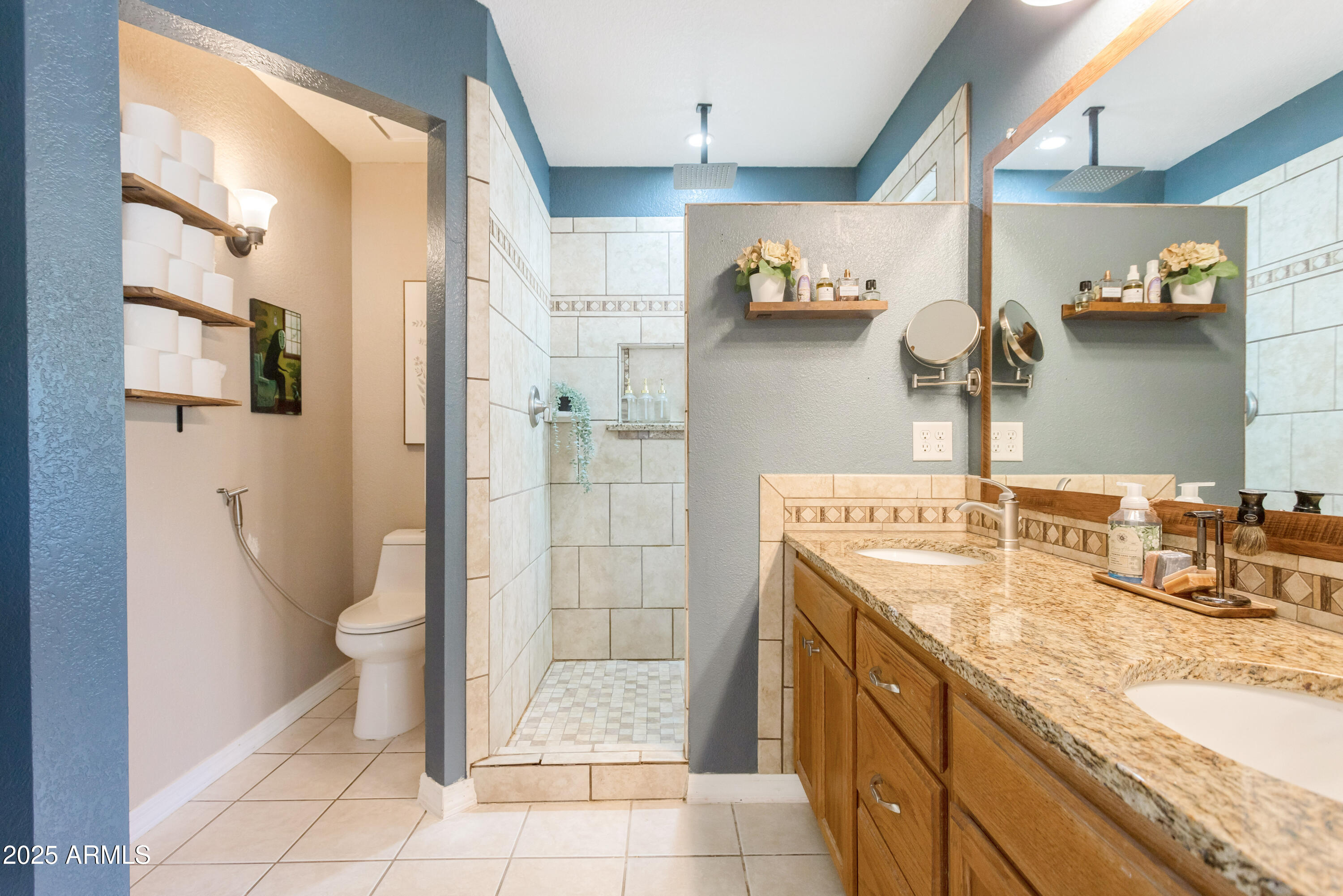 4931 Loma Loop Sierra Vista, AZ 85635 - Photo 28 of 47 a bathroom with a granite countertop sink toilet and shower
