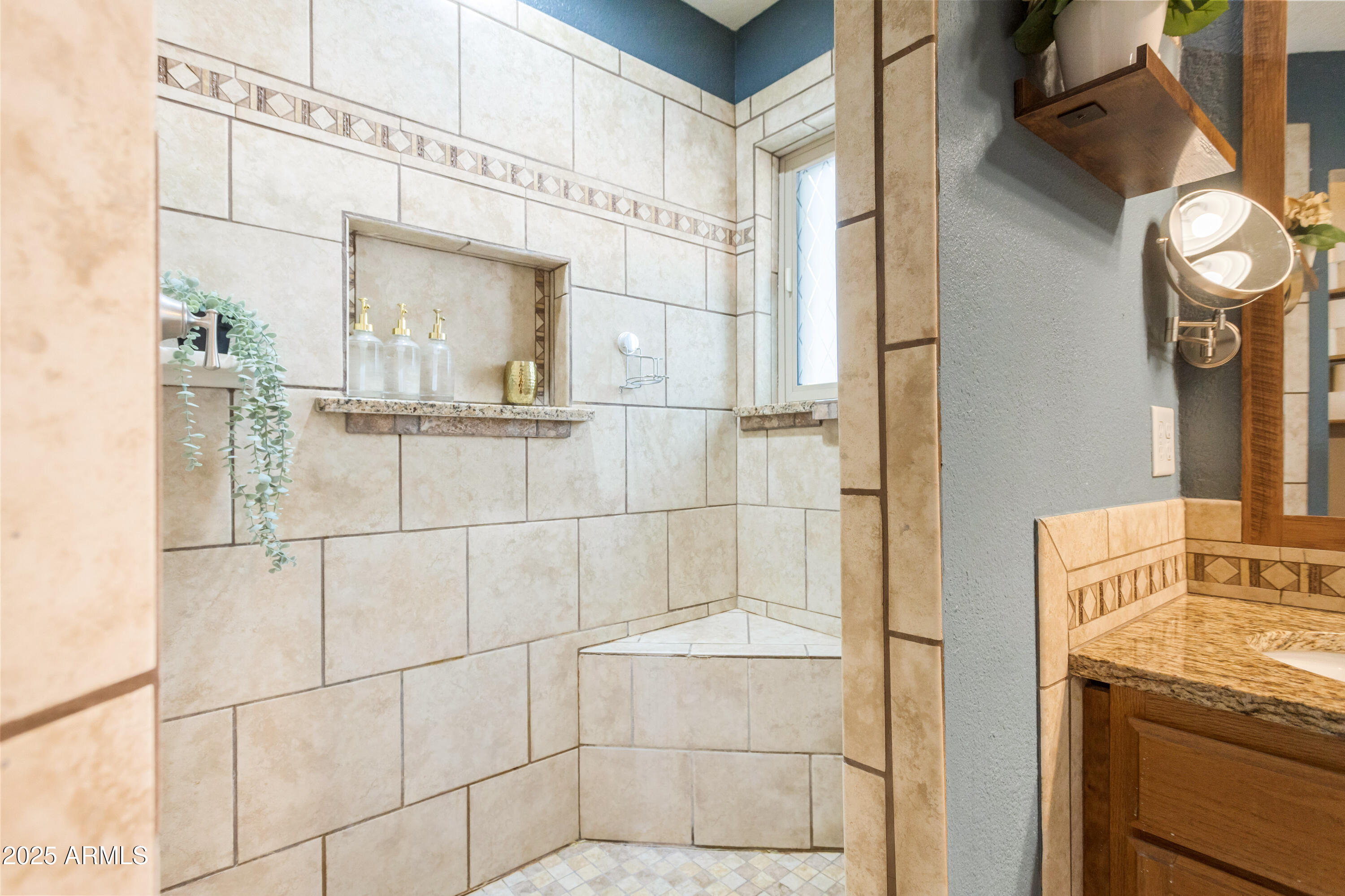 4931 Loma Loop Sierra Vista, AZ 85635 - Photo 29 of 47 a bathroom with a sink and a mirror