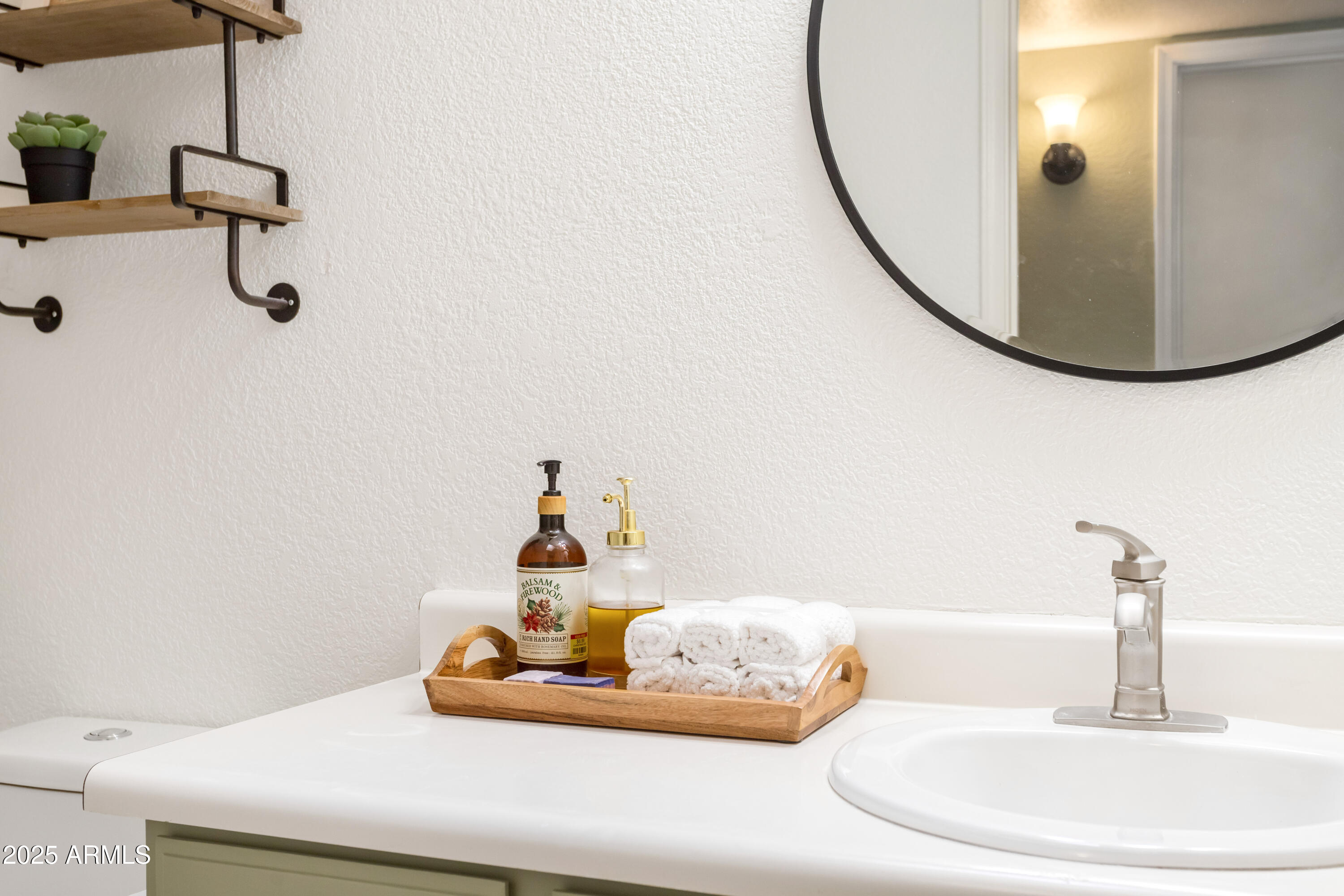 4931 Loma Loop Sierra Vista, AZ 85635 - Photo 32 of 47 a bathroom with a sink and mirror