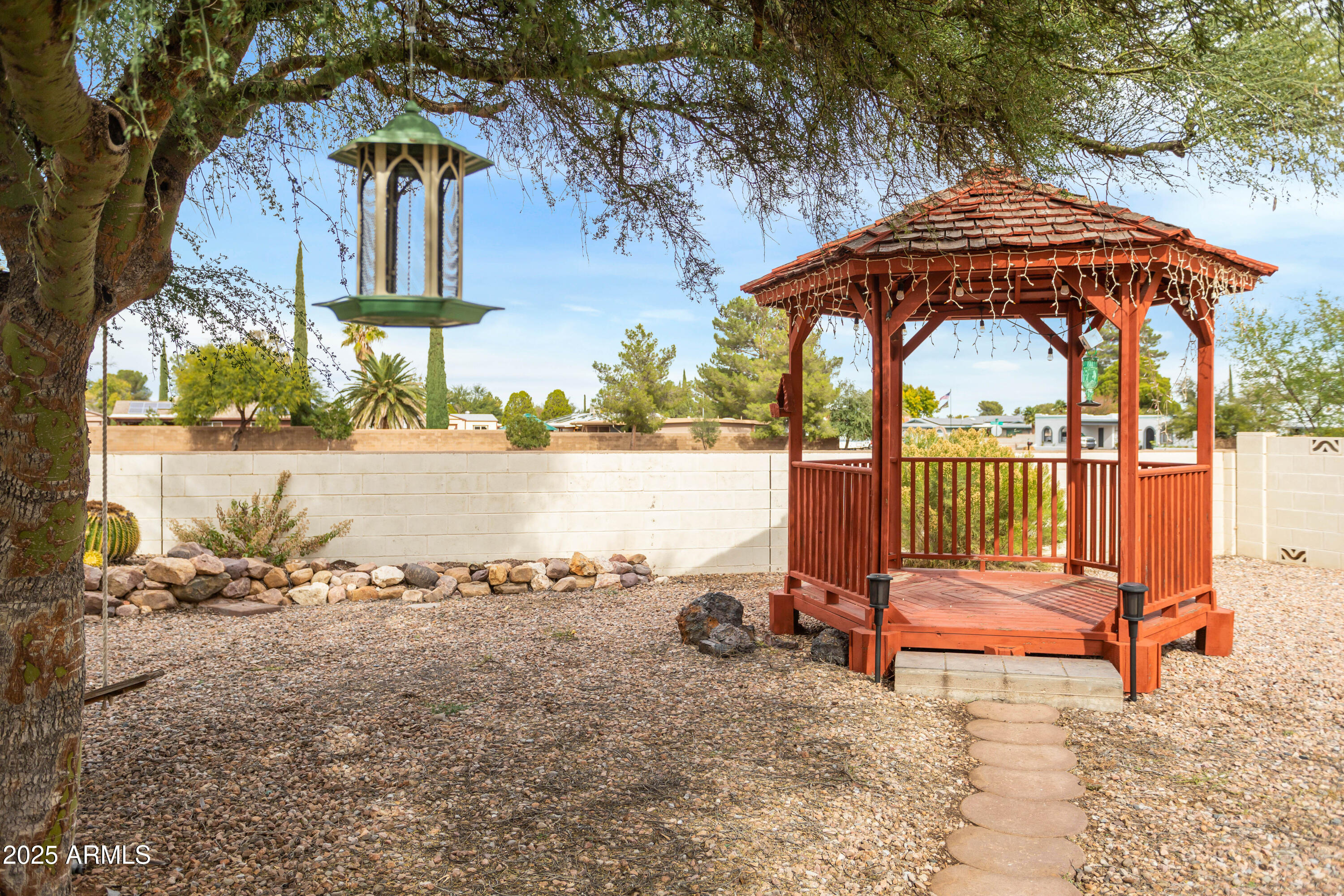 4931 Loma Loop Sierra Vista, AZ 85635 - Photo 42 of 47 a view of a bench in the patio next to a yard