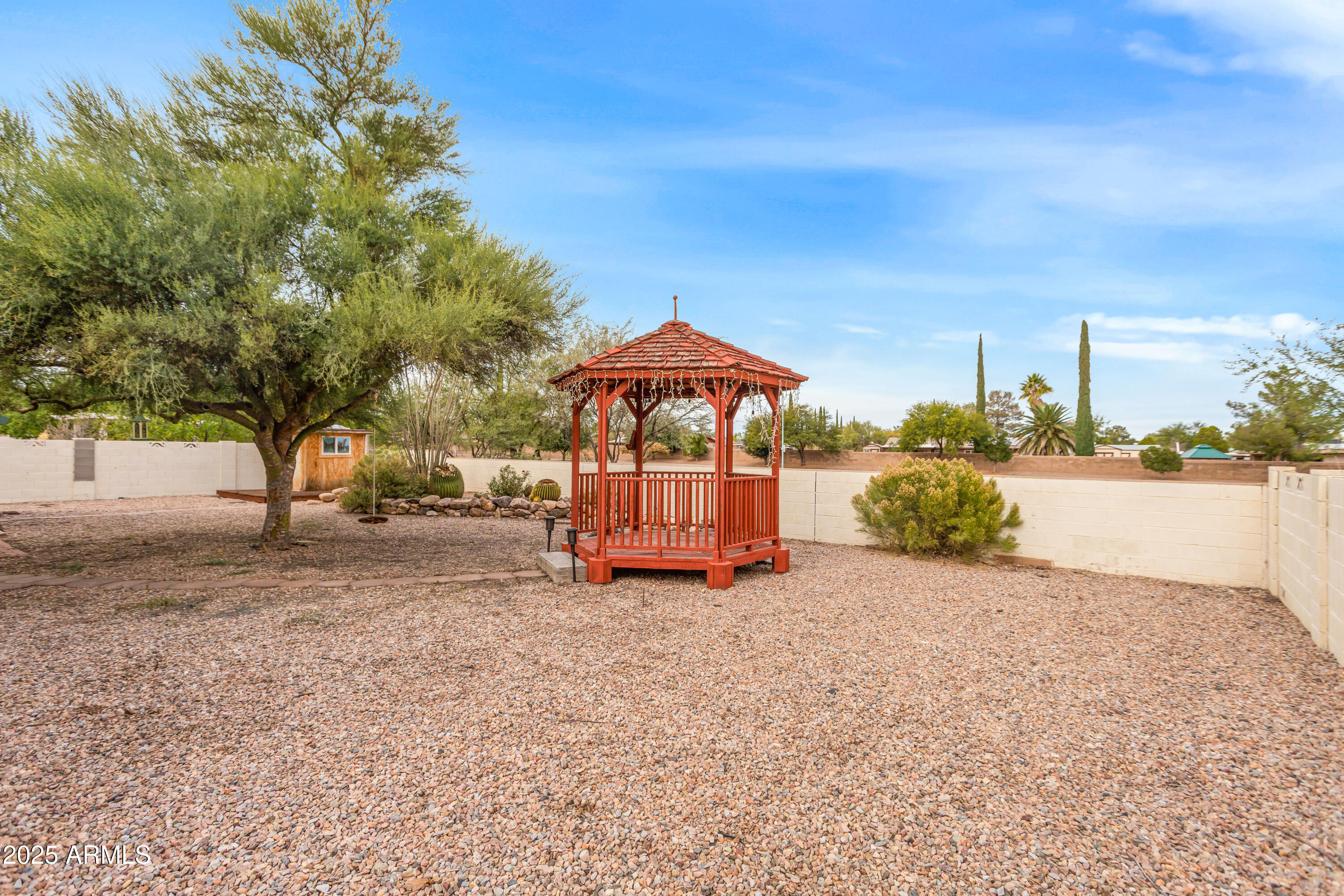 4931 Loma Loop Sierra Vista, AZ 85635 - Photo 43 of 47 a view of a house with a yard