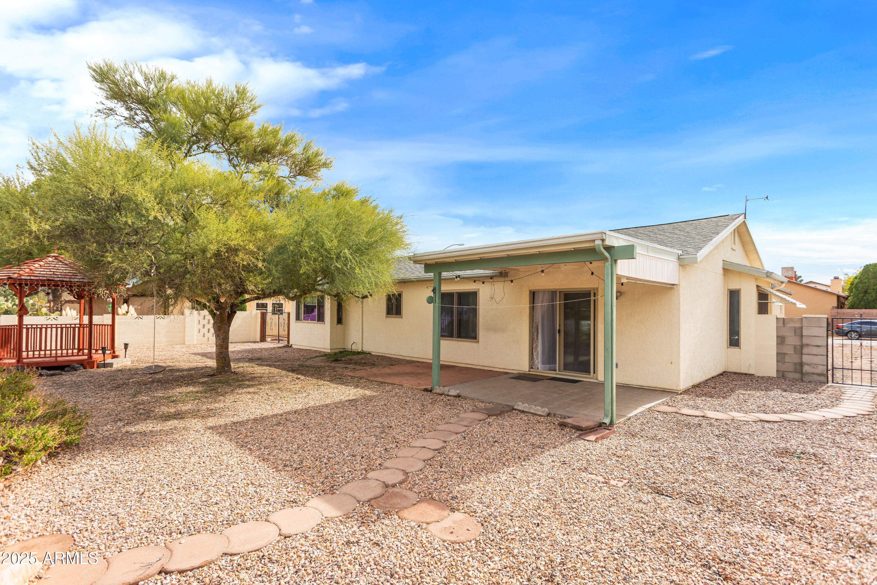 4931 Loma Loop Sierra Vista, AZ 85635 - Photo 46 of 47 a view of a house with a yard