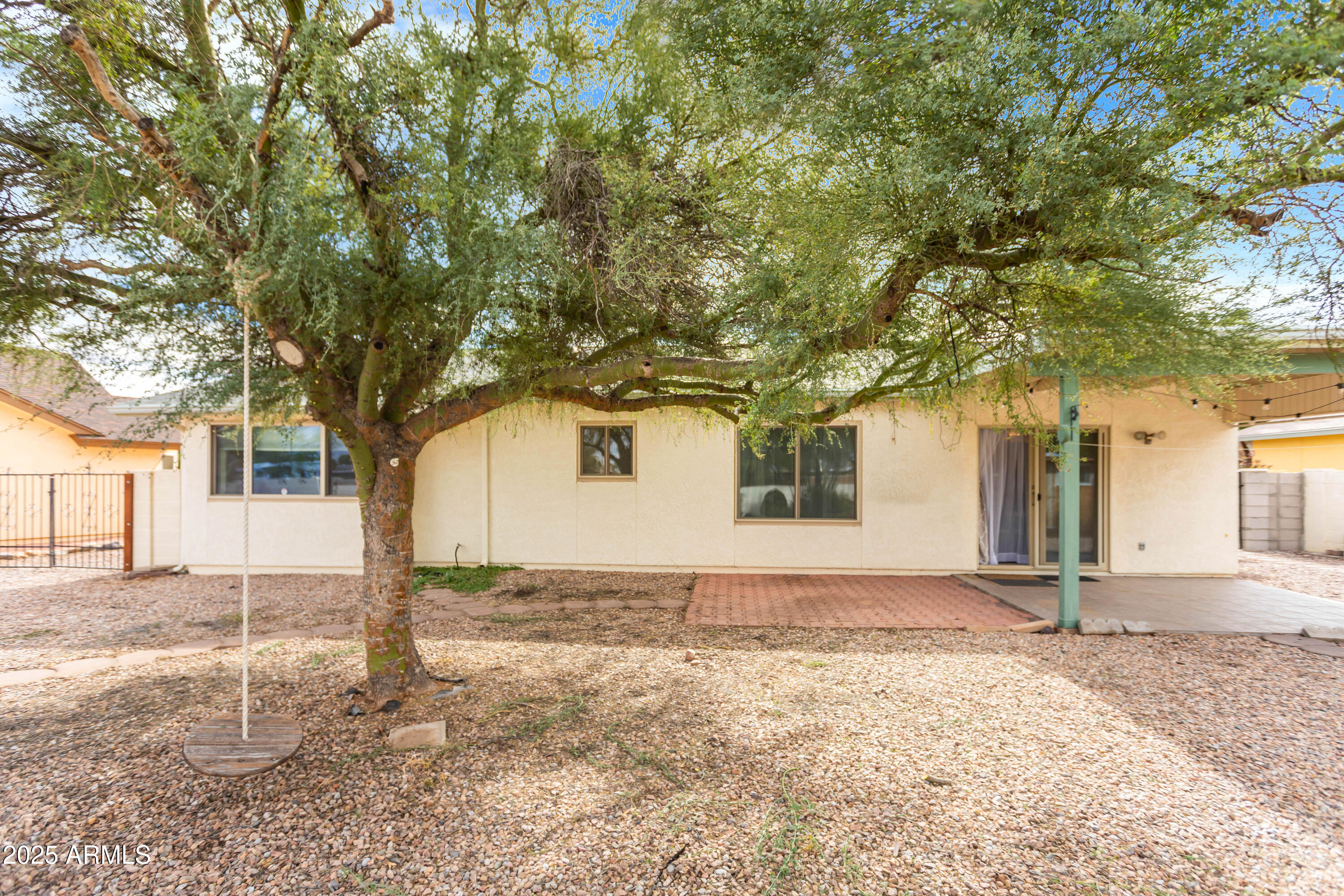 4931 Loma Loop Sierra Vista, AZ 85635 - Photo 47 of 47 a front view of a house with a yard and garage