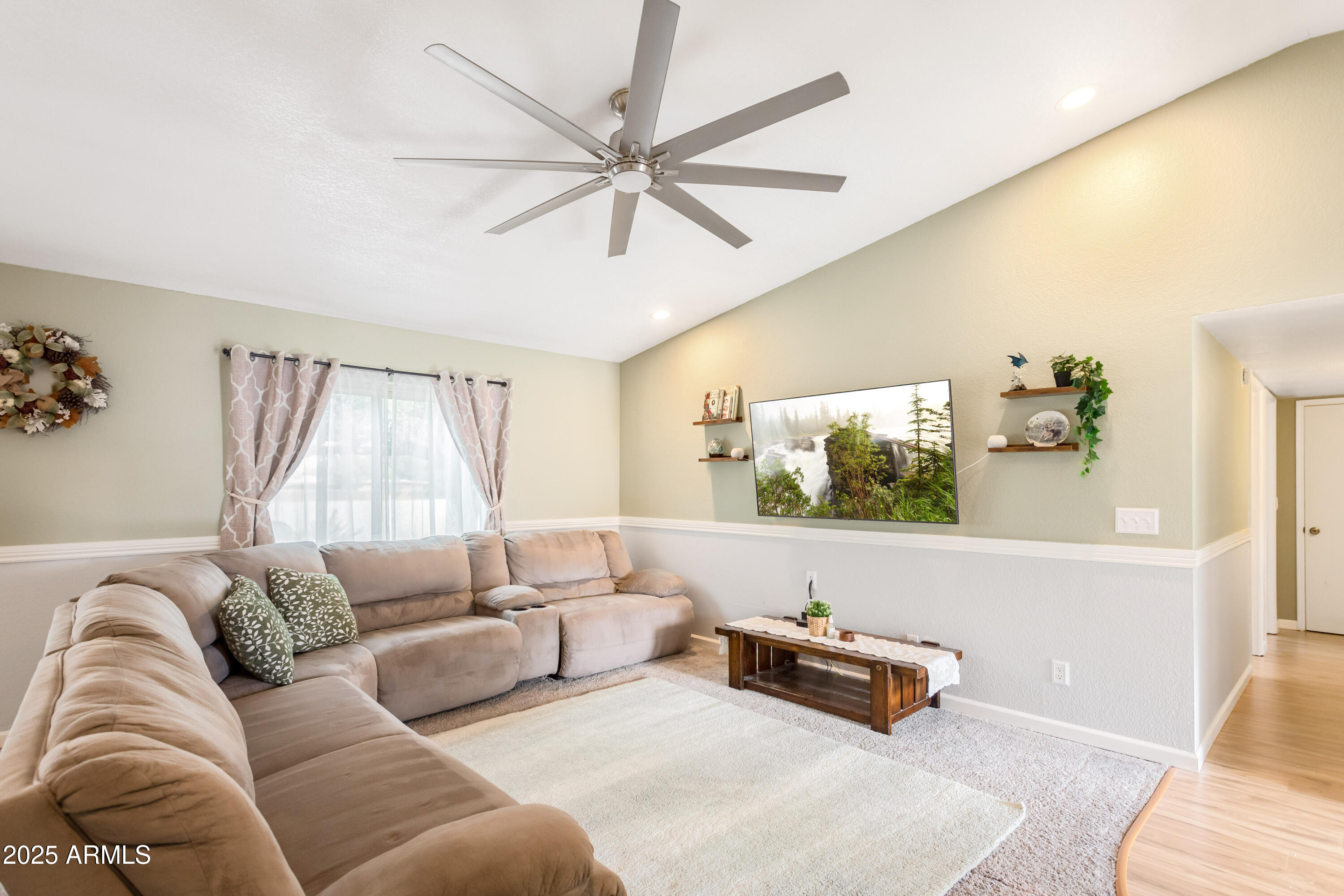 4931 Loma Loop Sierra Vista, AZ 85635 - Photo 9 of 47 a living room with furniture and a flat screen tv