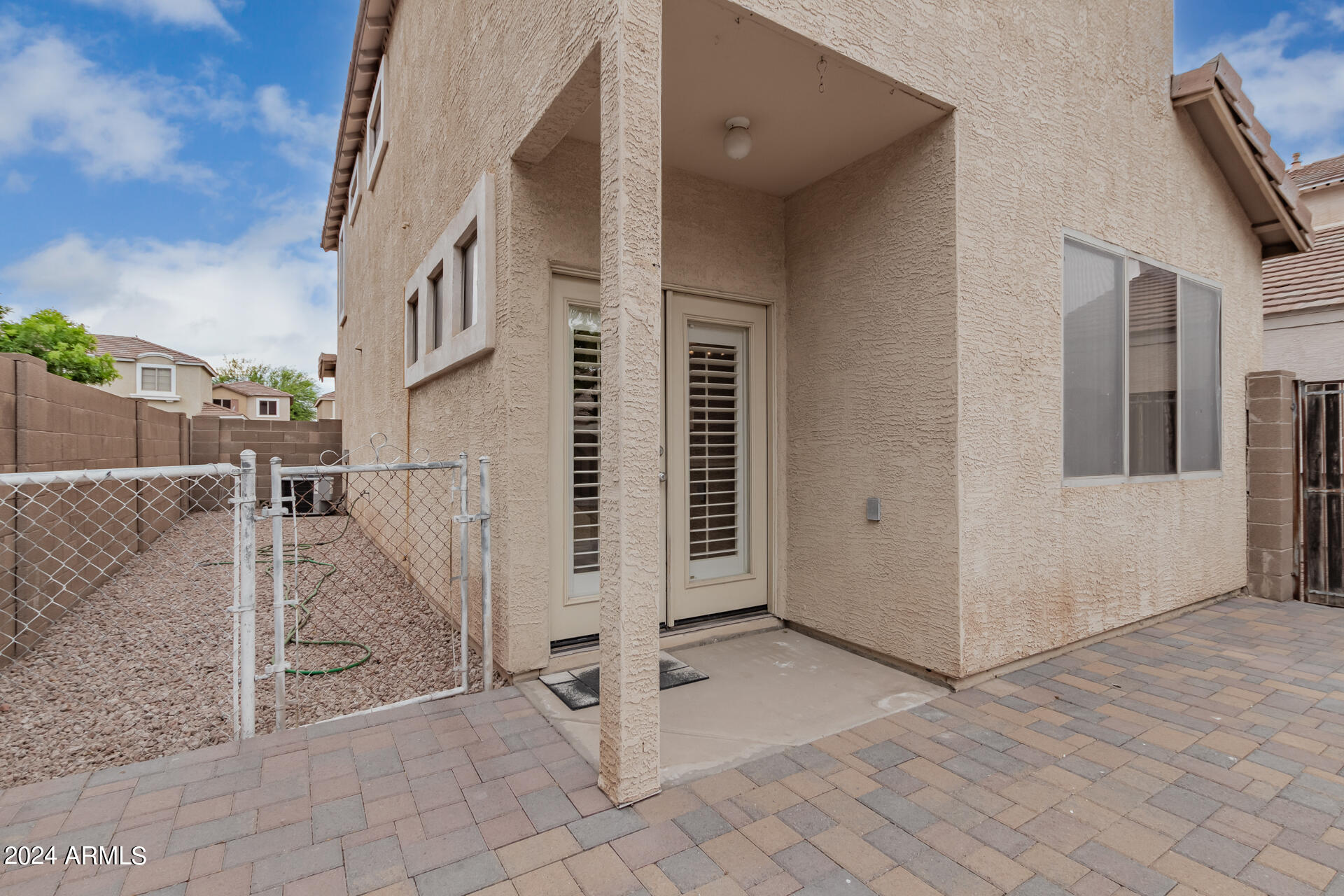 1371 South Boulder Street, Unit A Gilbert, AZ 85296 - Photo 36 of 43 a view of a house with a floor to ceiling window