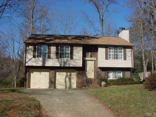 4324 Craddock Road Raleigh, NC 27613 - Photo 1 of 1 a front view of a house with a garden