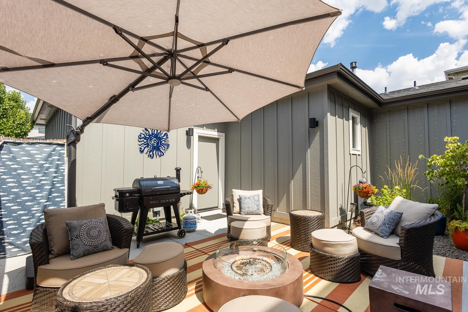 3321 South Hopes Well Way Boise, ID 83716 - Photo 23 of 40 View of patio featuring an outdoor living space with a fire pit and grilling area