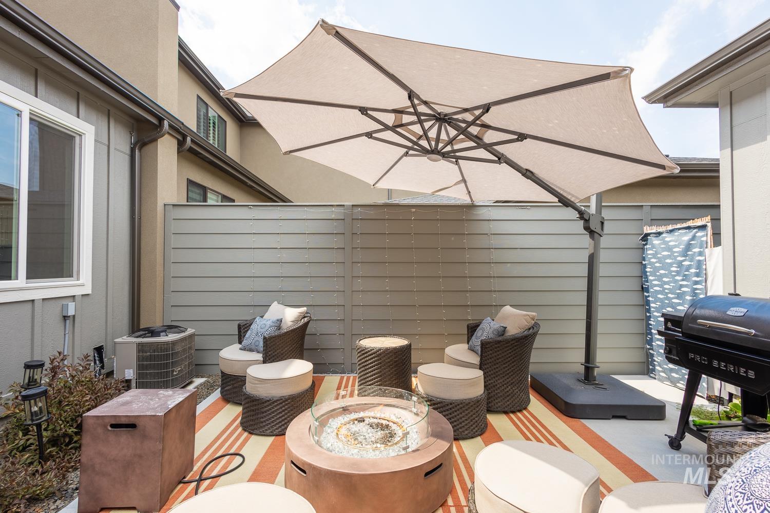 3321 South Hopes Well Way Boise, ID 83716 - Photo 6 of 40 View of patio / terrace featuring an outdoor fire pit and a grill