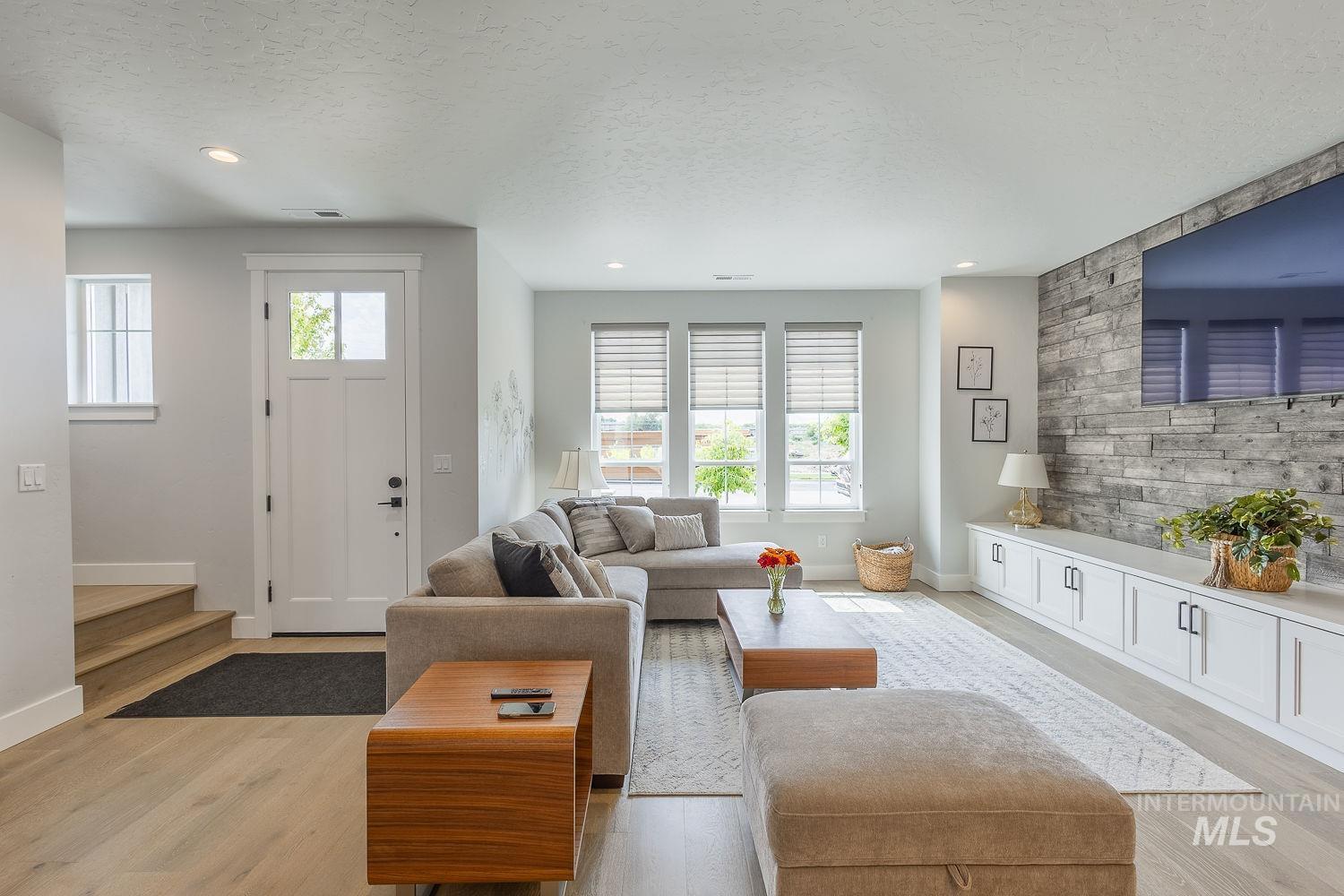 3321 South Hopes Well Way Boise, ID 83716 - Photo 8 of 40 Living area with a textured ceiling, light wood finished floors, and recessed lighting