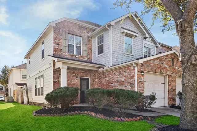 a view of a building with a yard
