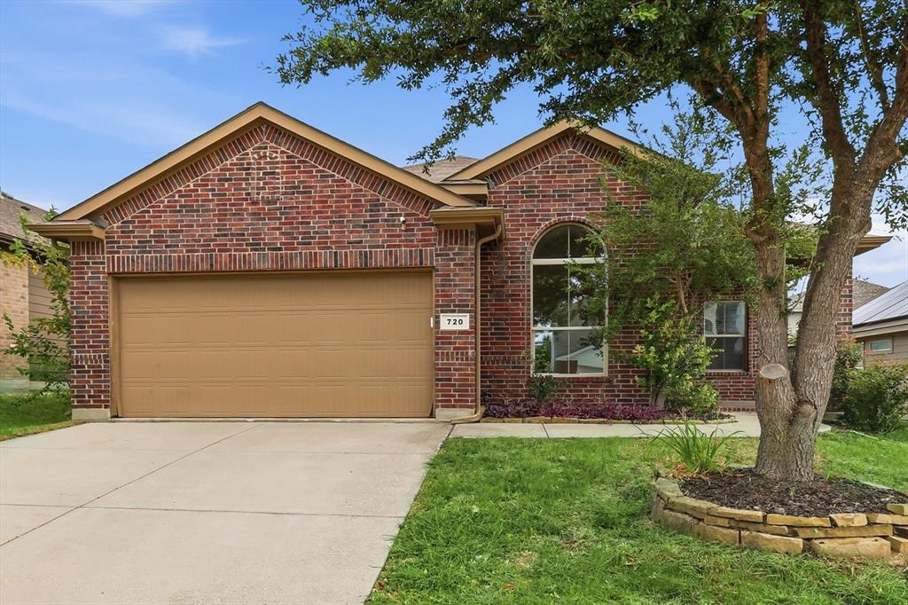 720 Rio Bravo Drive Fort Worth, TX 76052 - Photo 3 of 38 Brick exterior with a gabled roofline and an arched window