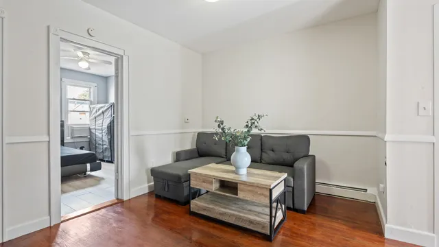 a living room with furniture and a gate