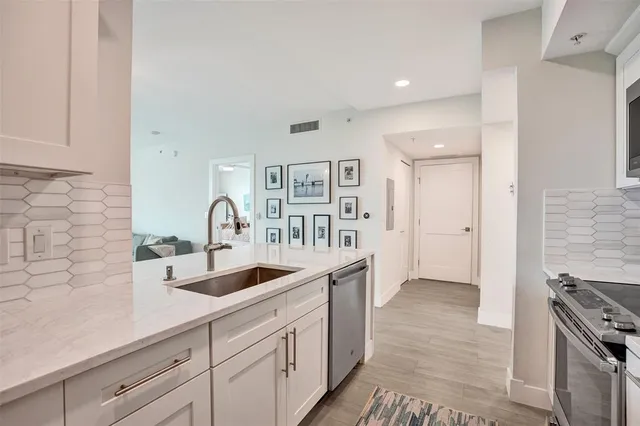 a bedroom with a bed and a night stand