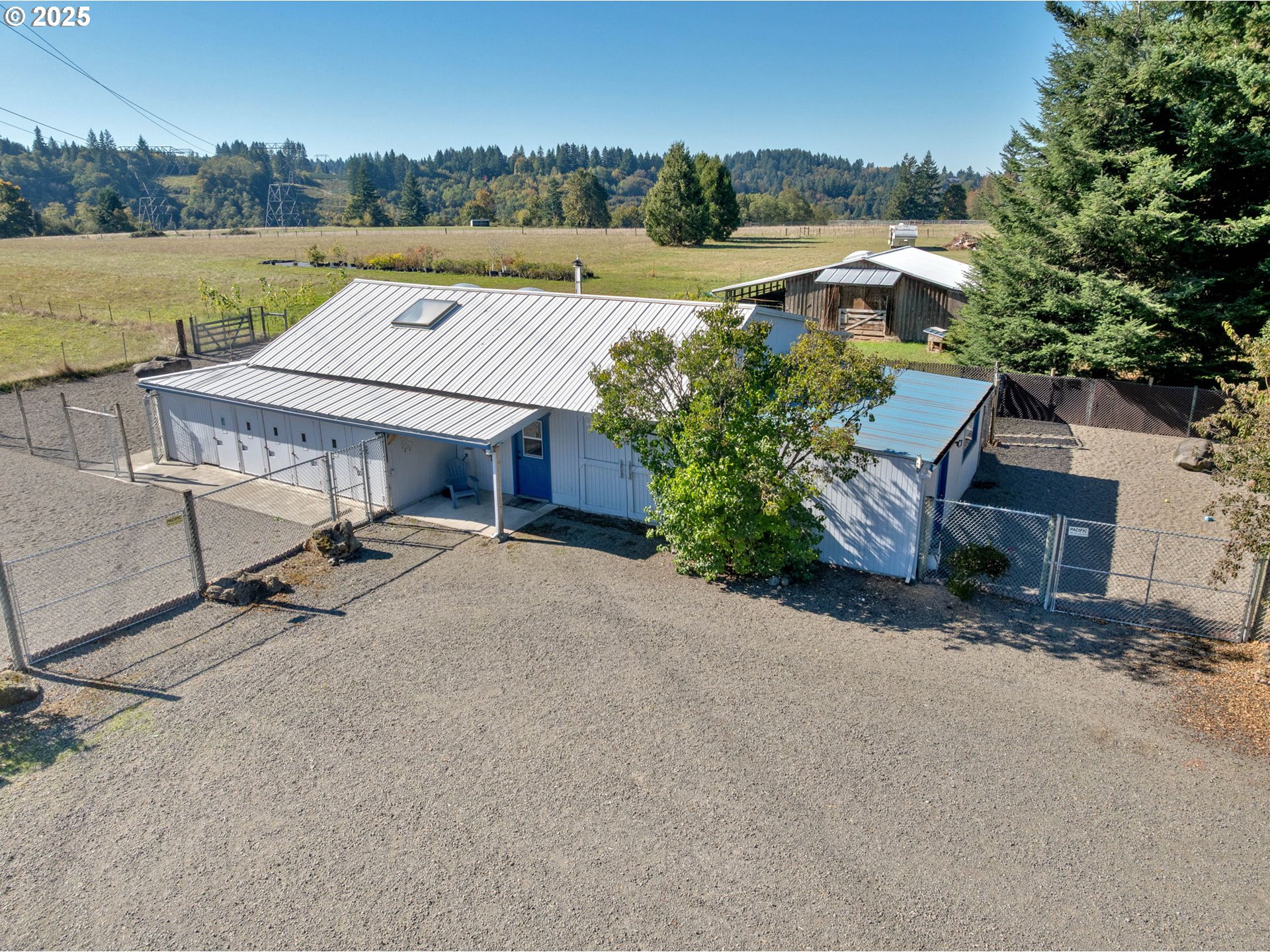 44434 Southeast Coalman Road Sandy, OR 97055 - Photo 12 of 48 an aerial view of a house with a yard and lake view