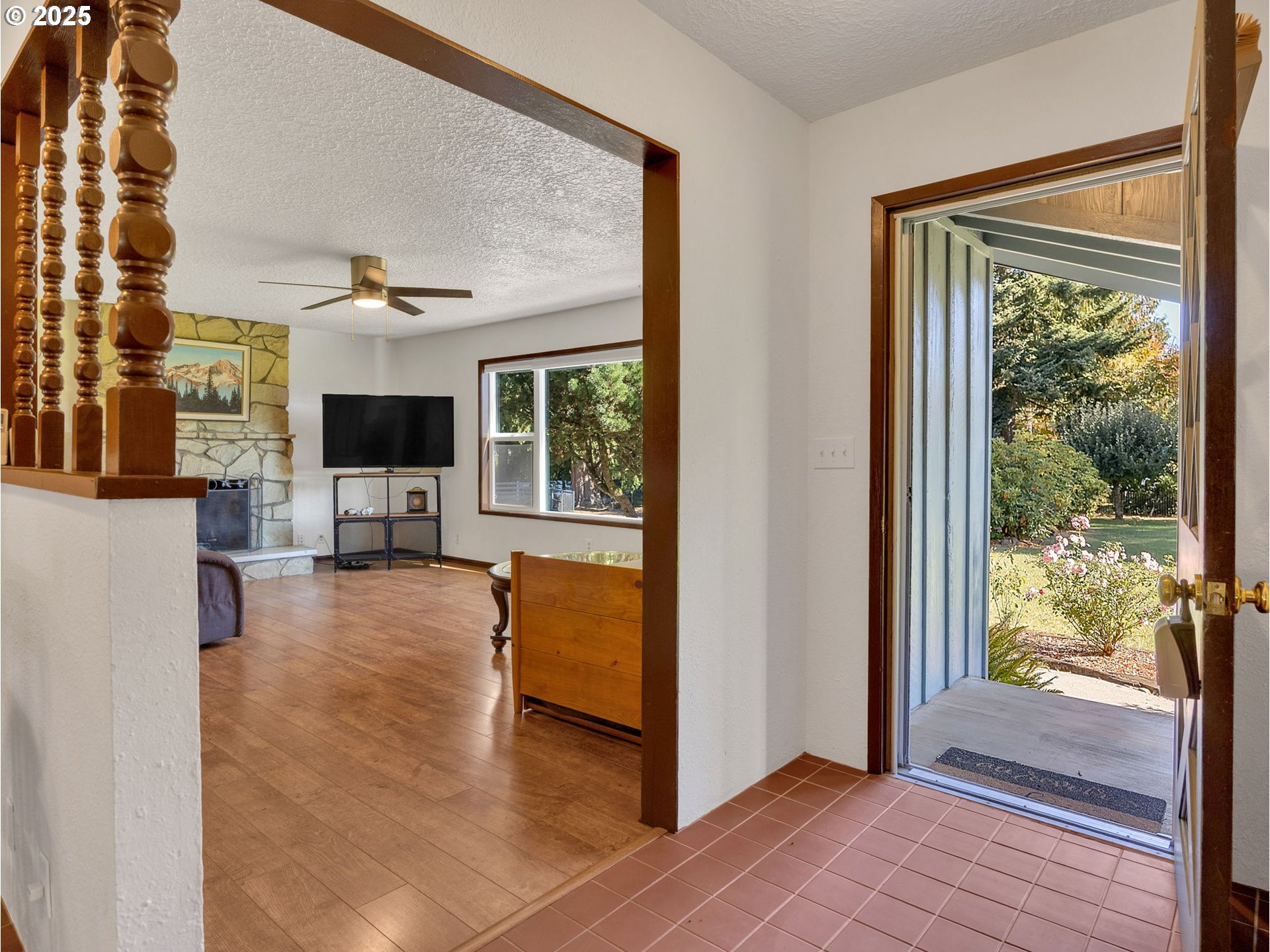 44434 Southeast Coalman Road Sandy, OR 97055 - Photo 23 of 48 a view of living room kitchen with furniture and flat screen tv