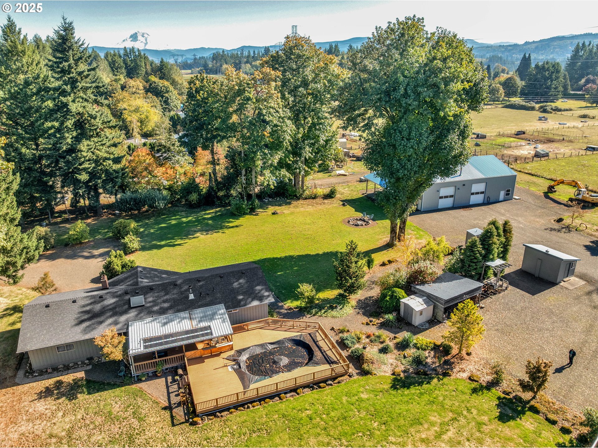 44434 Southeast Coalman Road Sandy, OR 97055 - Photo 4 of 48 an aerial view of a house with a yard and lake view