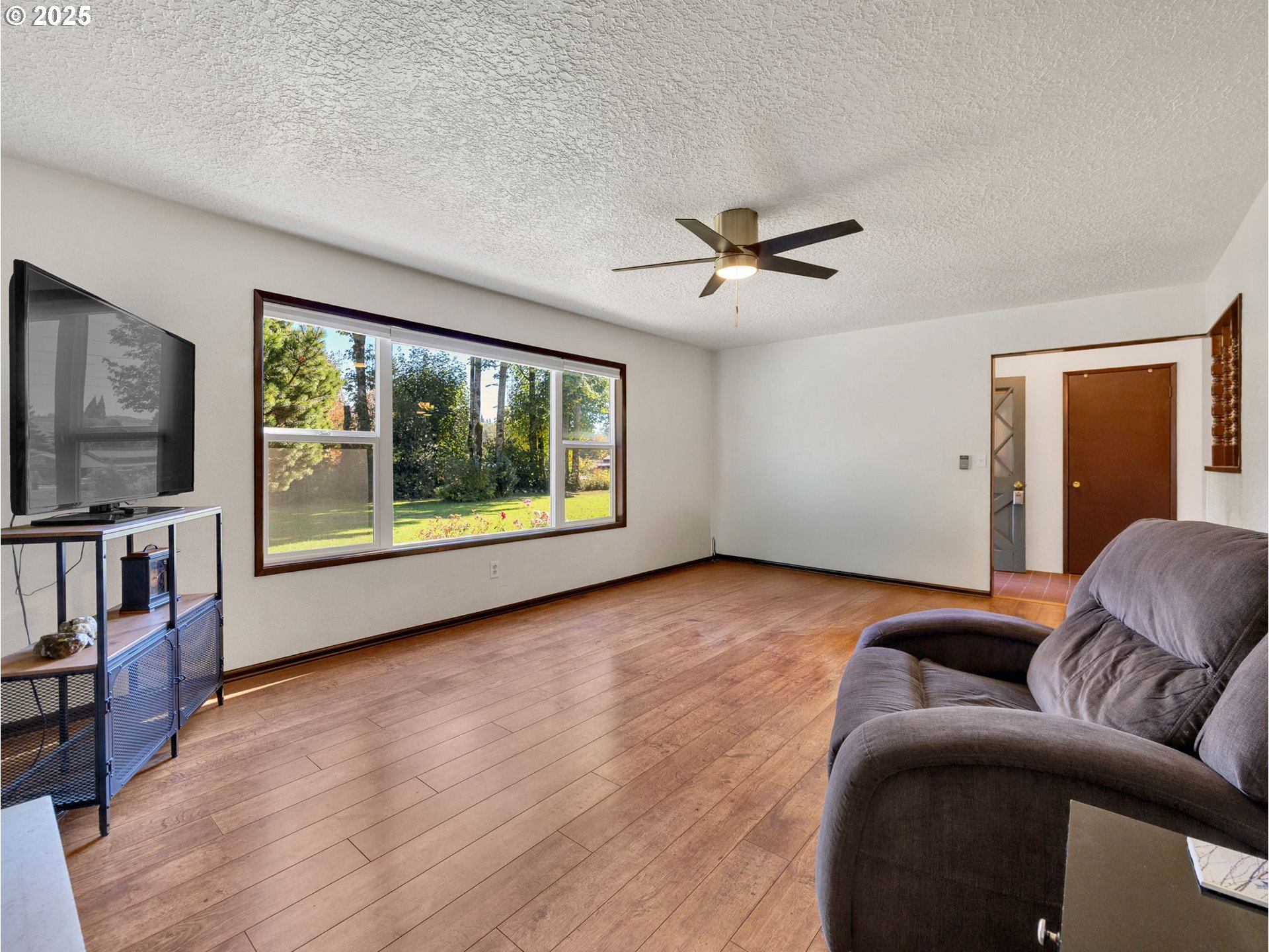 44434 Southeast Coalman Road Sandy, OR 97055 - Photo 41 of 48 a living room with furniture and a flat screen tv