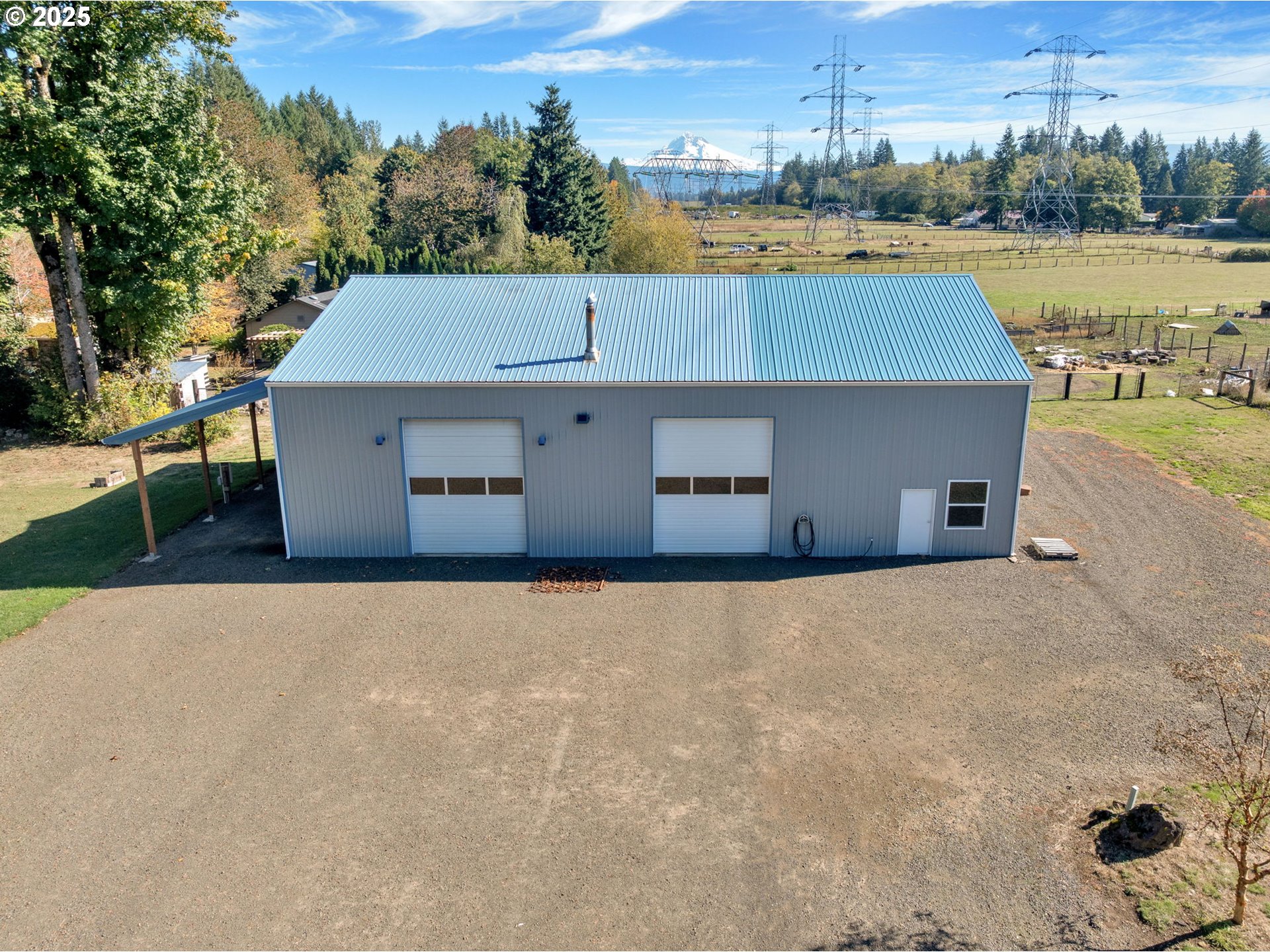 44434 Southeast Coalman Road Sandy, OR 97055 - Photo 7 of 48 an aerial view of a house with outdoor space and lake view in back