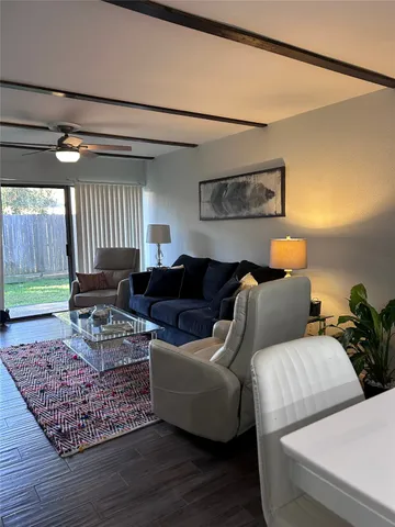 a living room with furniture and a rug
