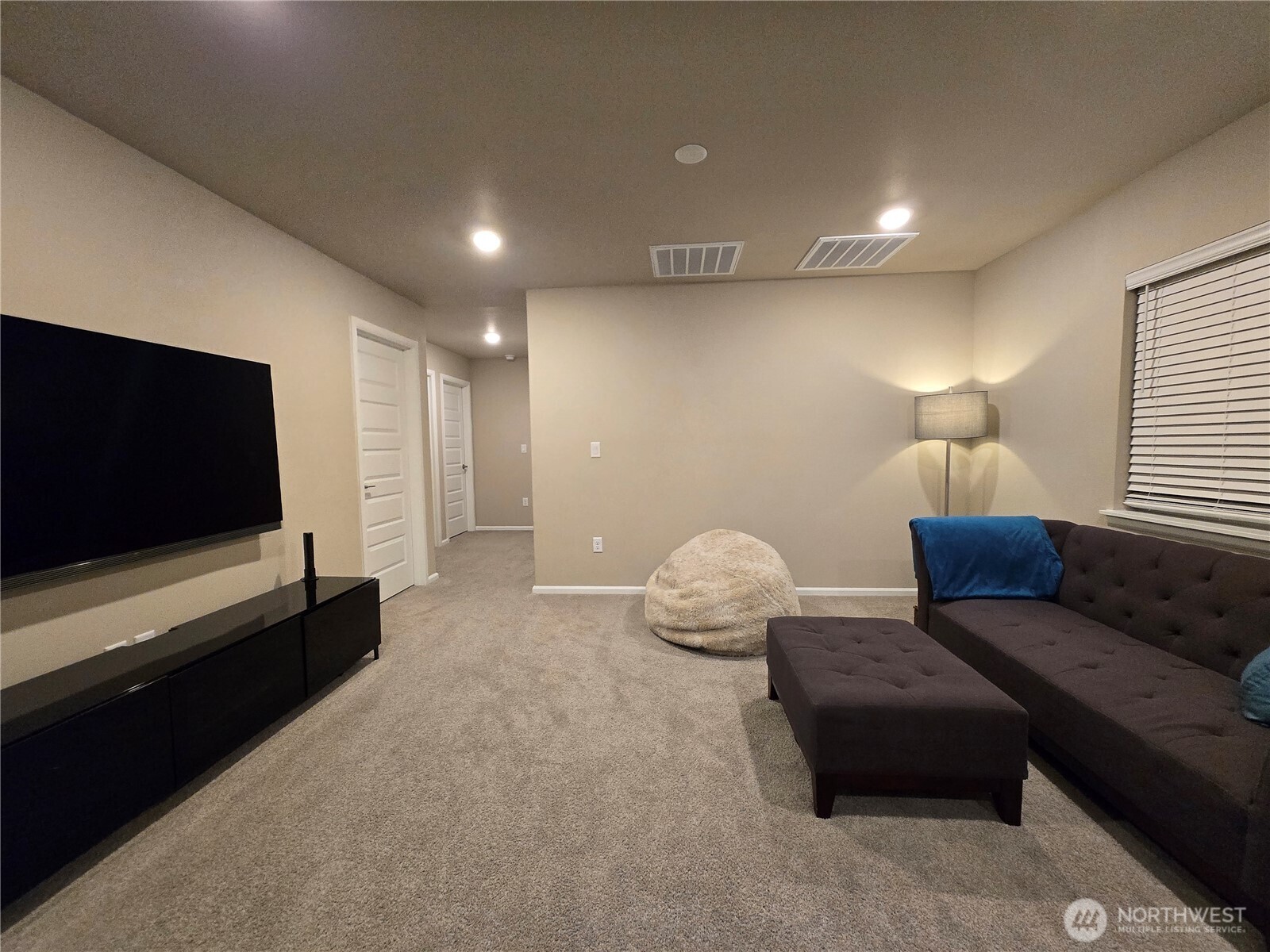 28902 239th Avenue Southeast Maple Valley, WA 98010 - Photo 11 of 22 a living room with furniture and a flat screen tv