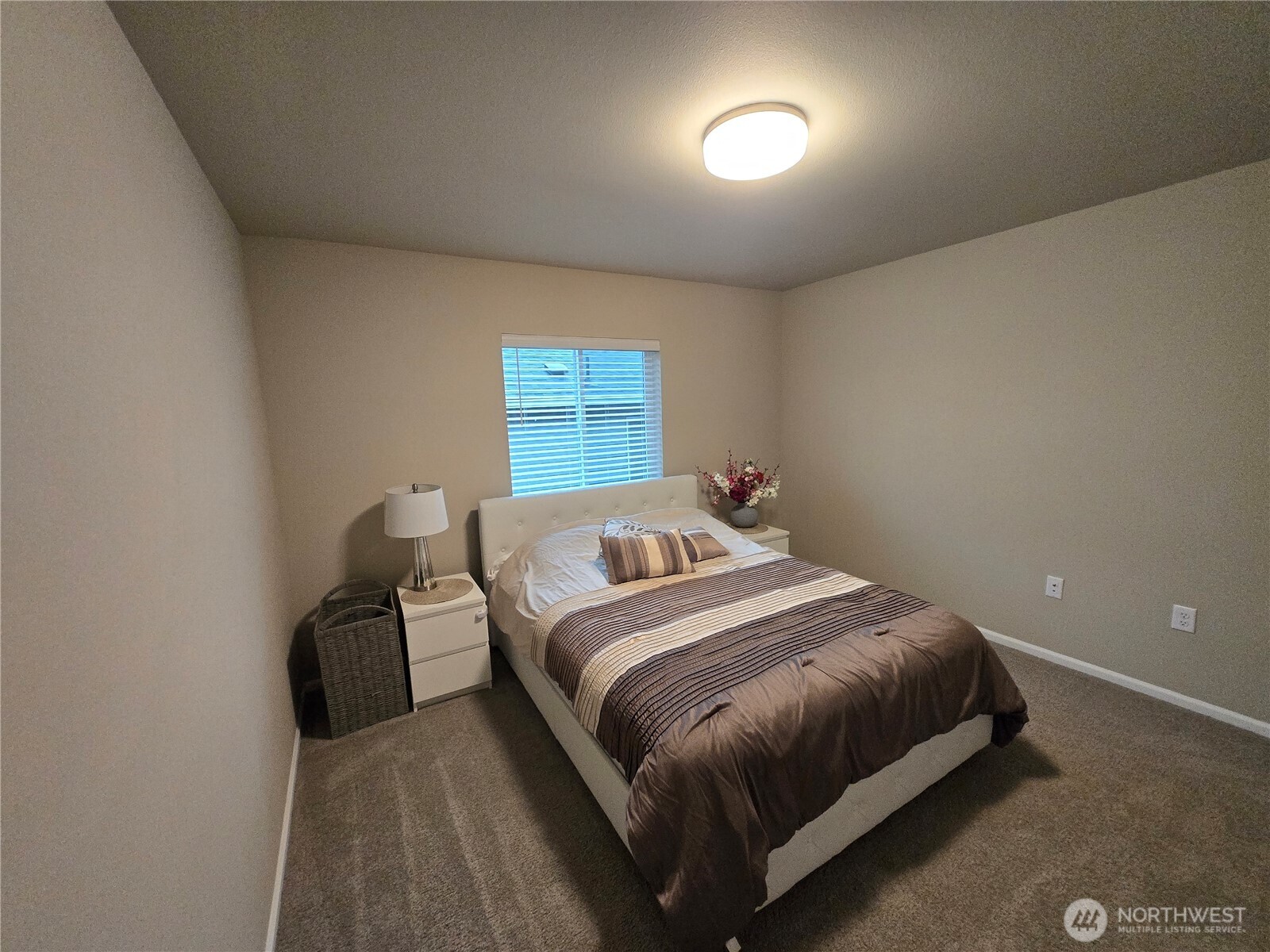 28902 239th Avenue Southeast Maple Valley, WA 98010 - Photo 13 of 22 a bedroom with a bed and a night stand