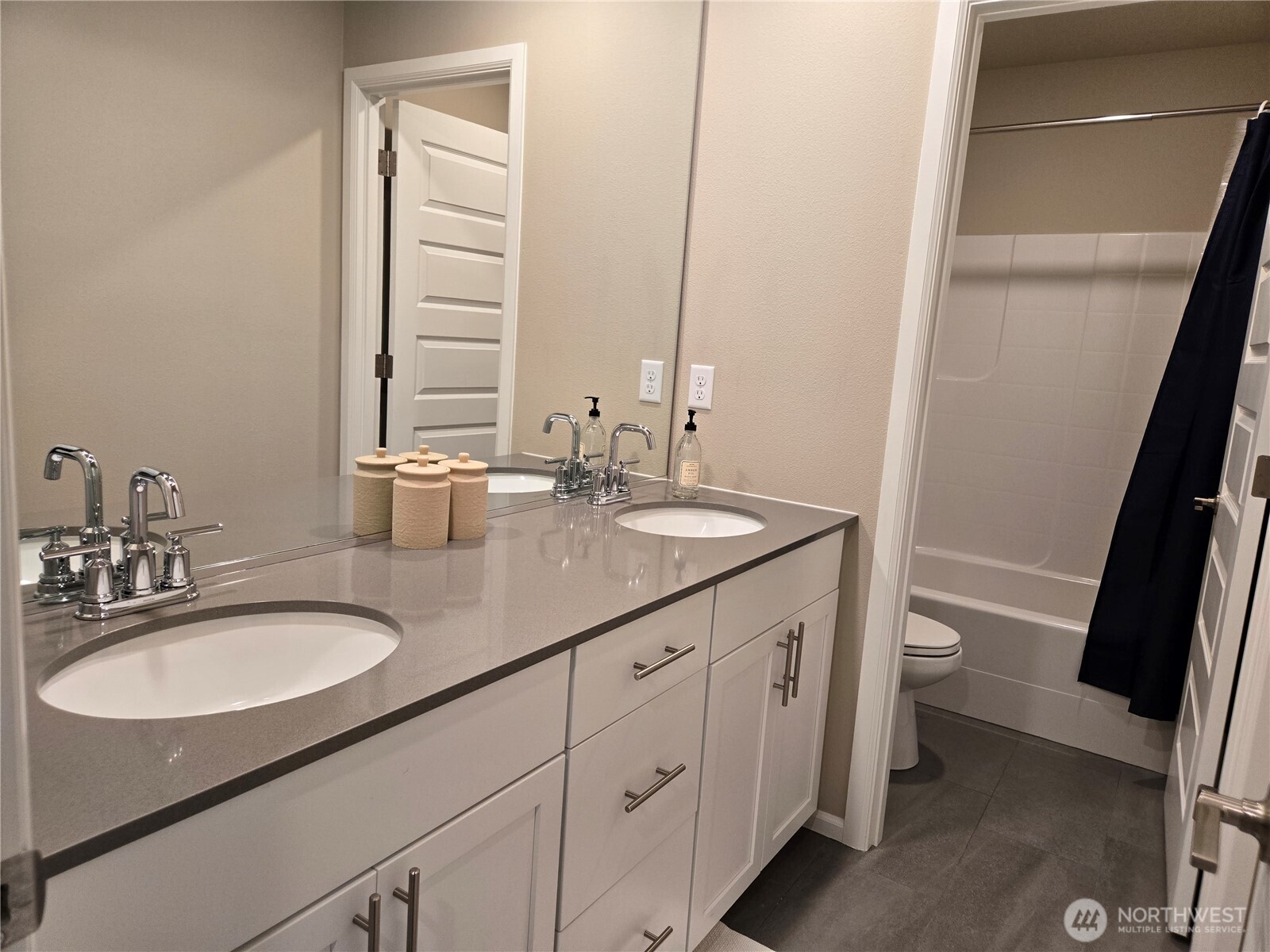 28902 239th Avenue Southeast Maple Valley, WA 98010 - Photo 15 of 22 a bathroom with a granite countertop sink toilet and a mirror