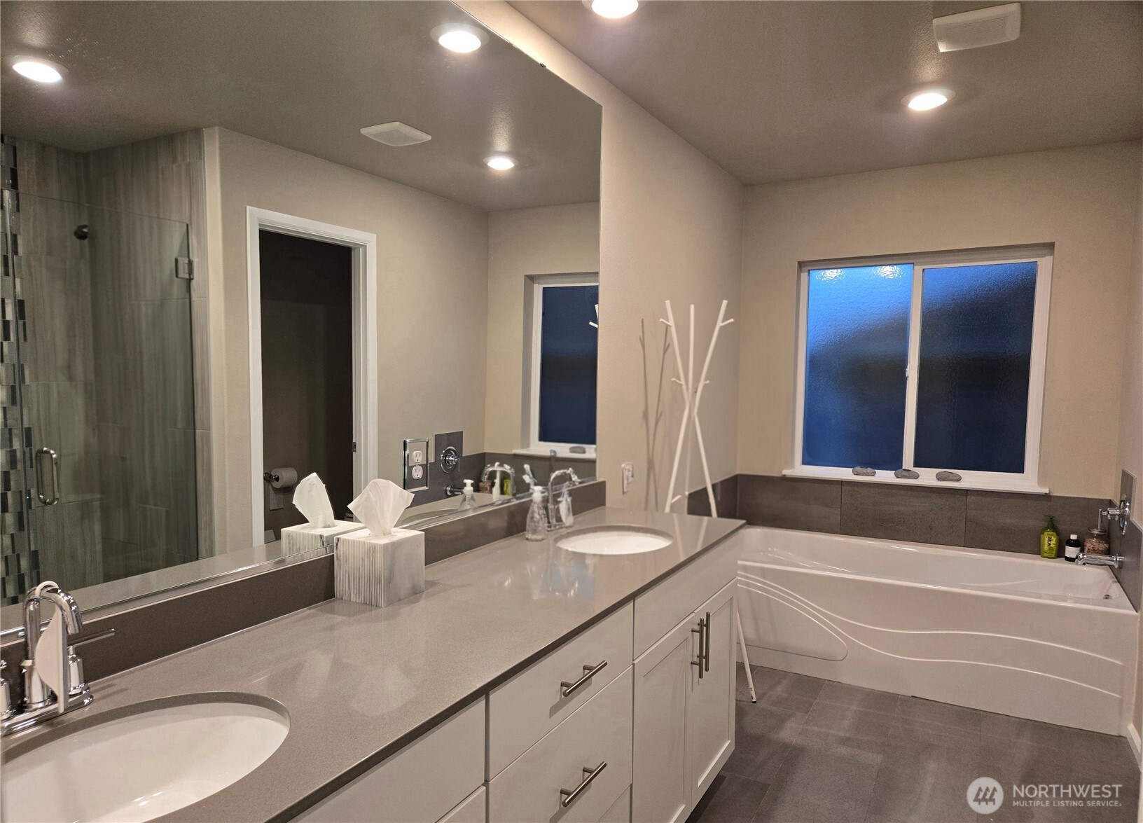 28902 239th Avenue Southeast Maple Valley, WA 98010 - Photo 17 of 22 a bathroom with a granite countertop sink and a large mirror