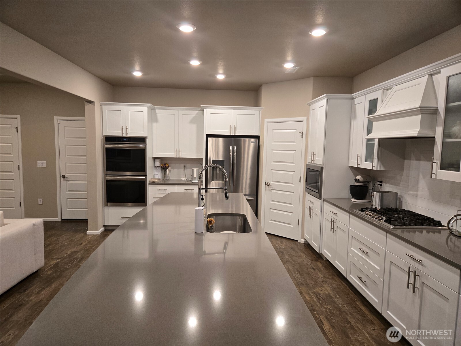 28902 239th Avenue Southeast Maple Valley, WA 98010 - Photo 8 of 22 a kitchen with stainless steel appliances a refrigerator sink and microwave