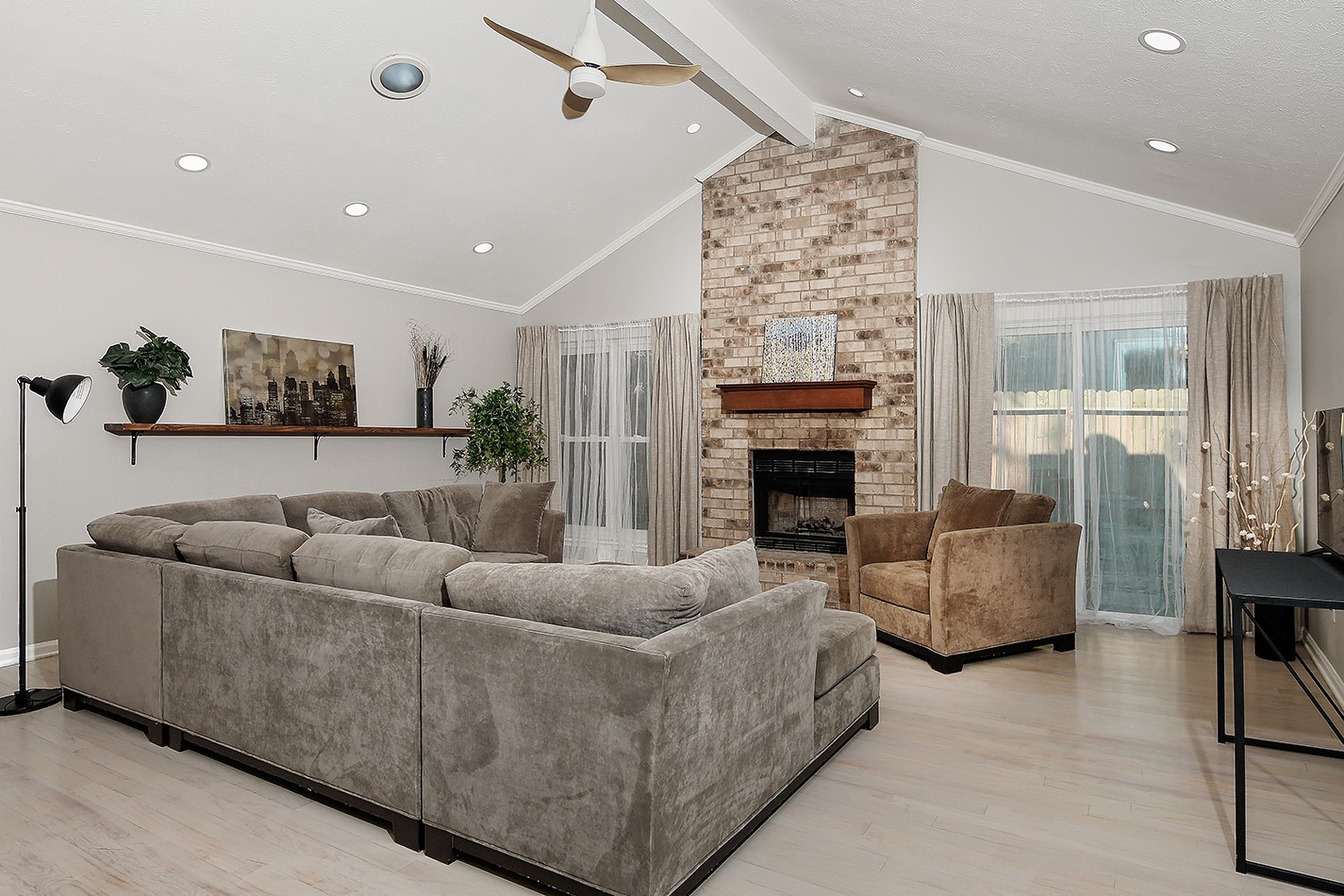 99 North Deerfoot Circle Spring, TX 77380 - Photo 6 of 22 a living room with furniture and a fireplace