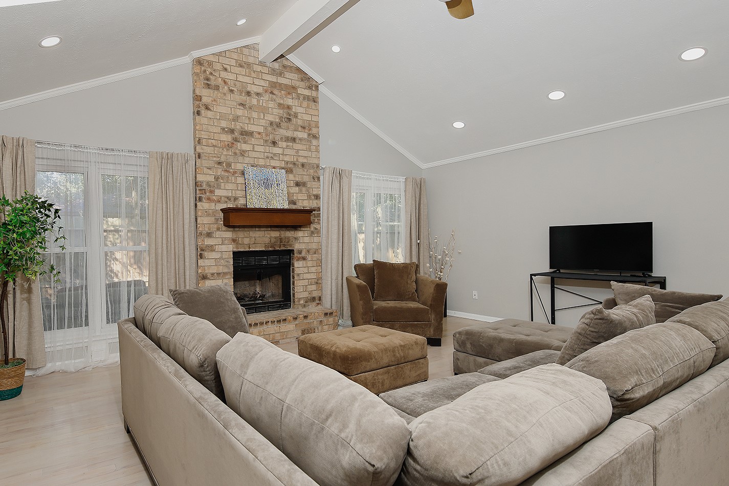 99 North Deerfoot Circle Spring, TX 77380 - Photo 8 of 22 a living room with furniture and a flat screen tv